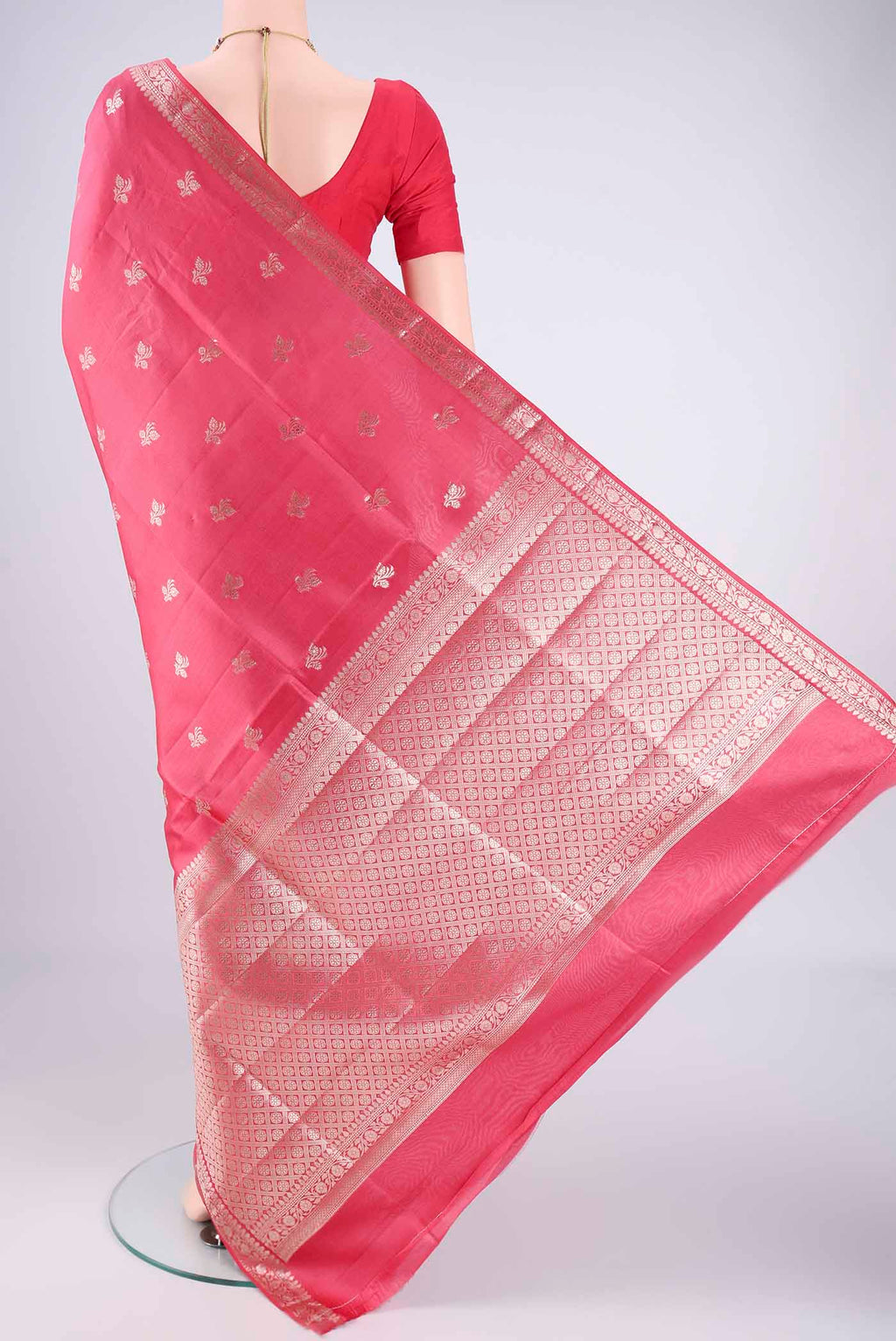 Flat view of Peach Banarasi Raw Silk Saree with Zari Butta on the body and Zari Border. 