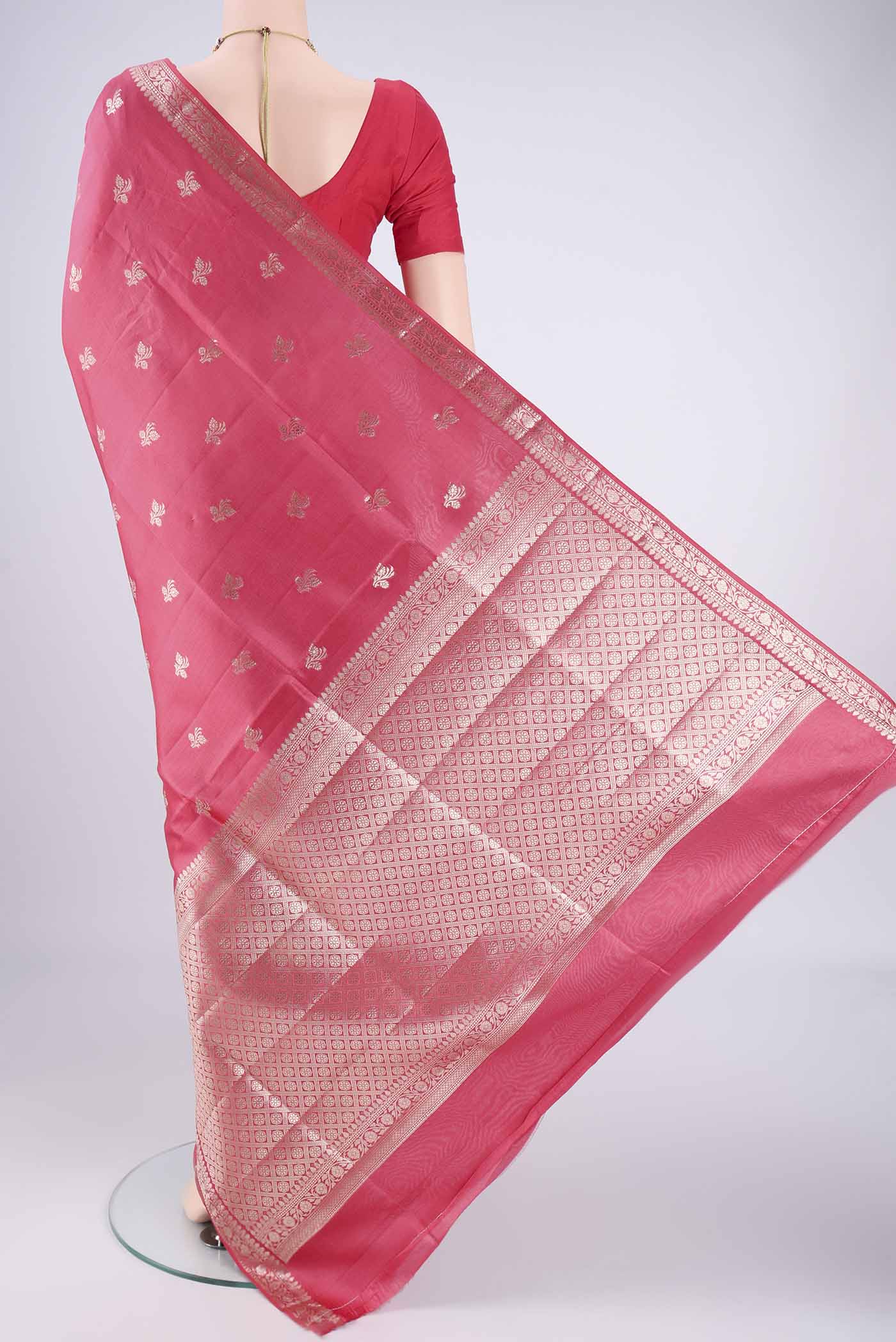 Flat view of Peach Banarasi Raw Silk Saree with Zari Butta on the body and Zari Border. 