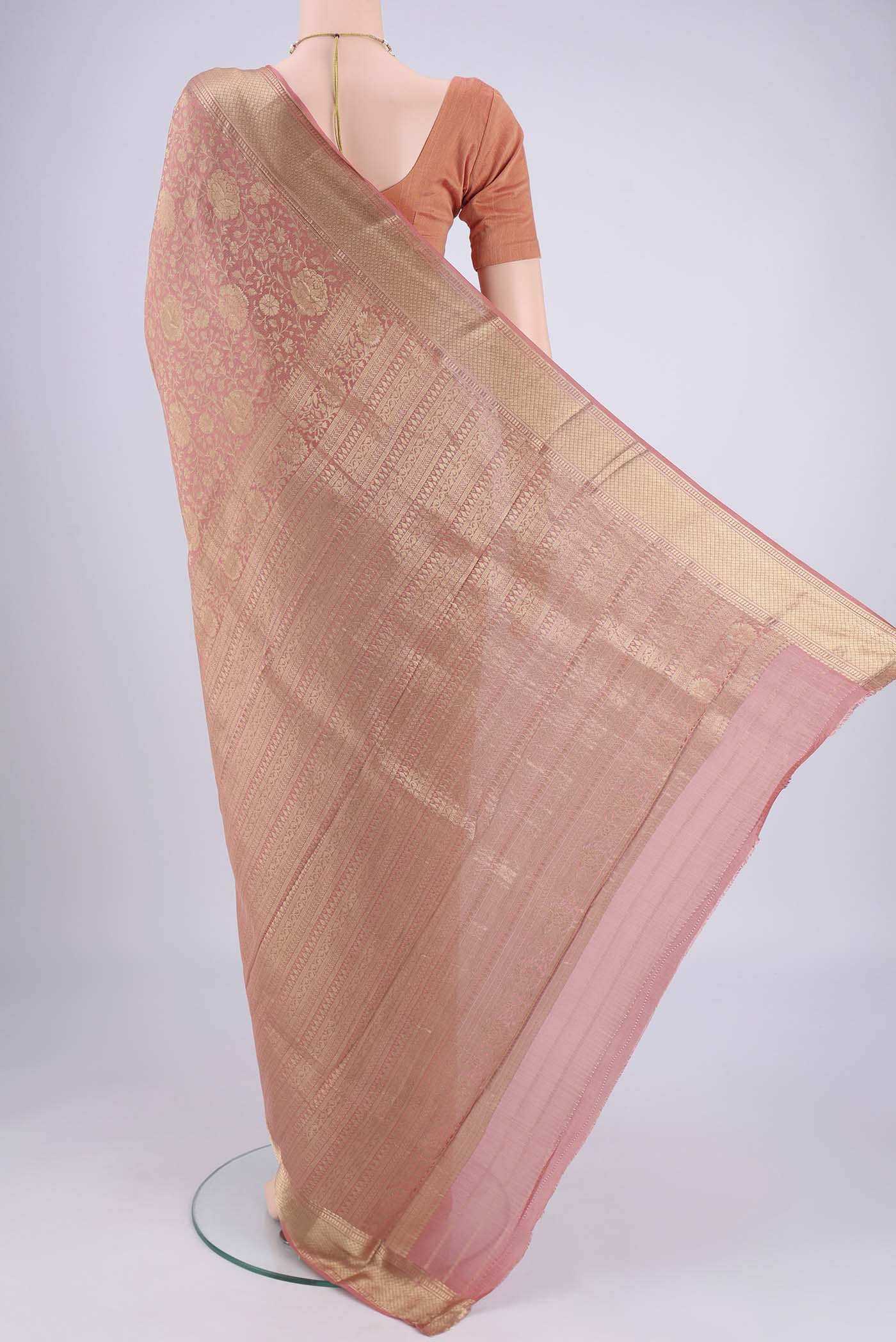 Flat view of Peach Mysore Crepe Saree with Zari Brocade on the body and Zari Border. 