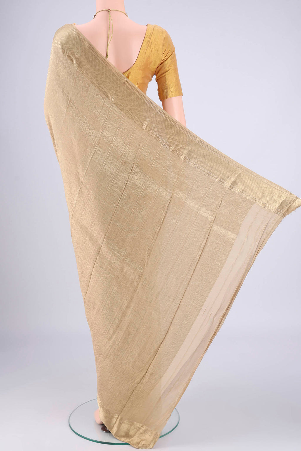 Flat view of Dark Beige Mysore Crepe Saree with Zari Brocade on the body and Zari Border. 