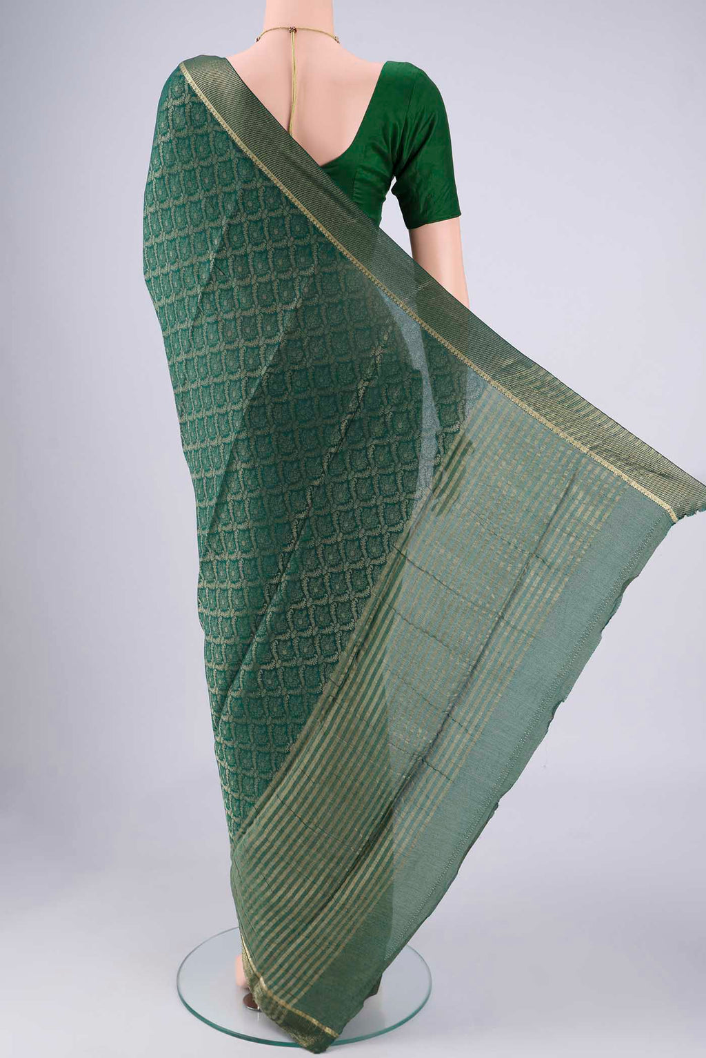 Flat view of Bottle Green Mysore Crepe Saree with Zari Brocade on the body and Zari Border. 