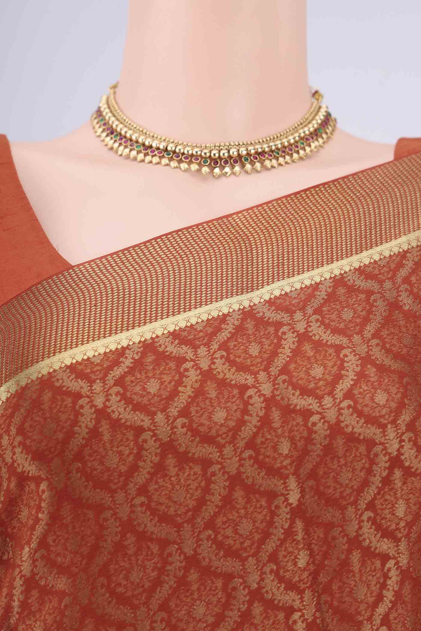 Border image of Rust Mysore Crepe Saree with Zari Brocade on the body and Zari Border. 