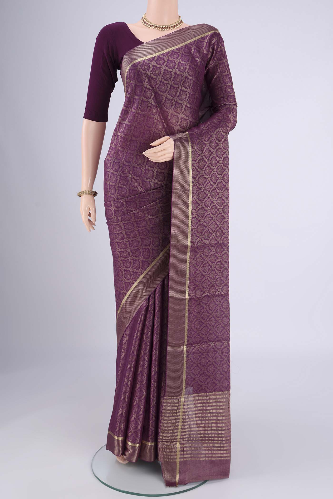 Purple Mysore Crepe Saree with Zari Brocade on the body and Zari Border.  displayed on a mannequin