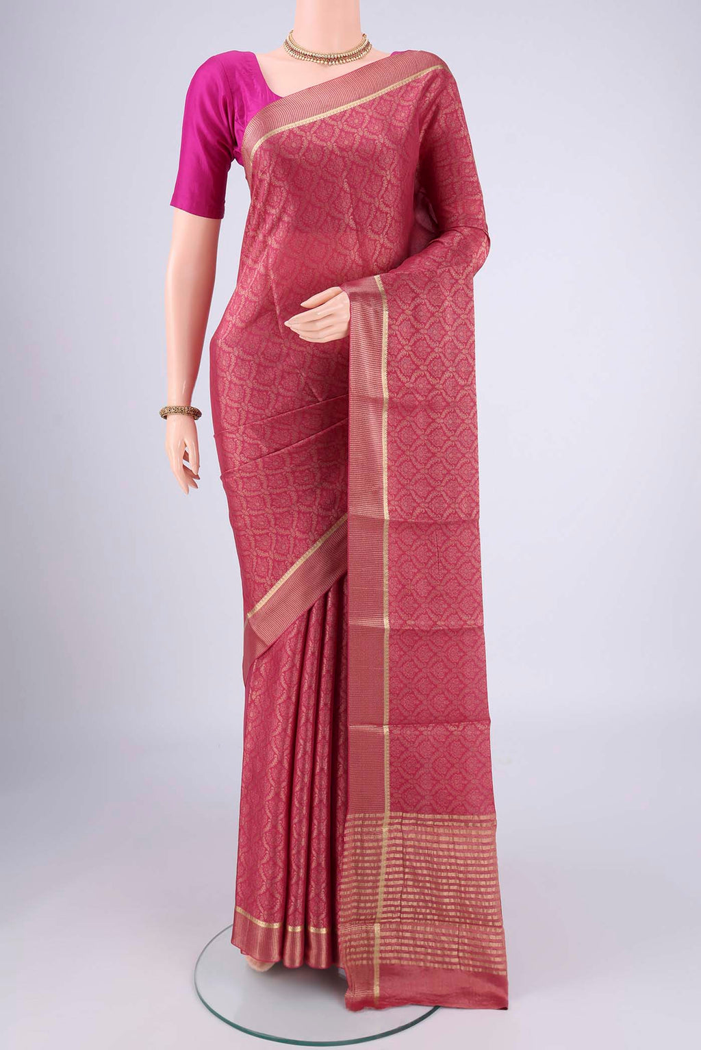 Pink Mysore Crepe Saree with Zari Brocade on the body and Zari Border.  displayed on a mannequin