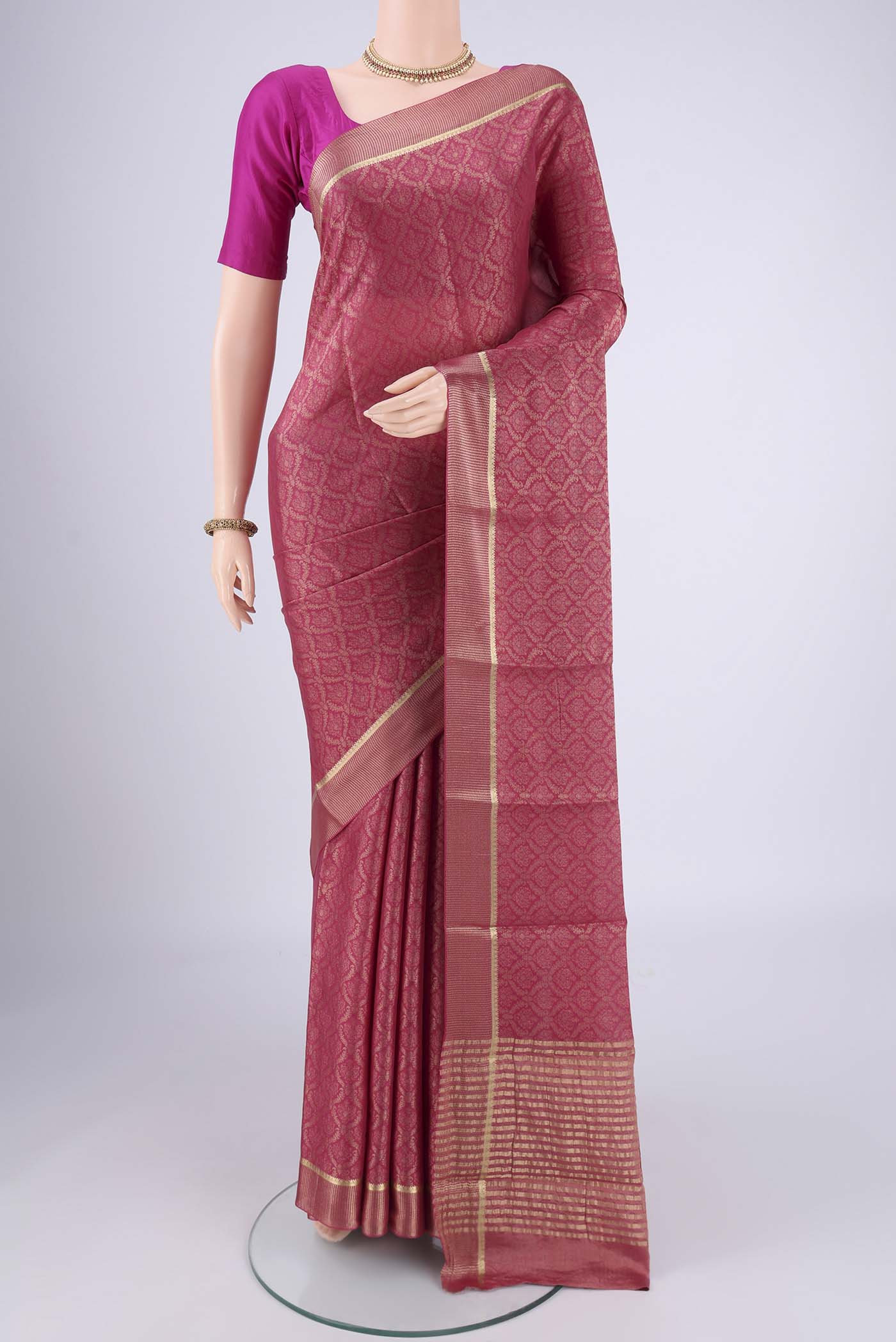 Pink Mysore Crepe Saree with Zari Brocade on the body and Zari Border.  displayed on a mannequin