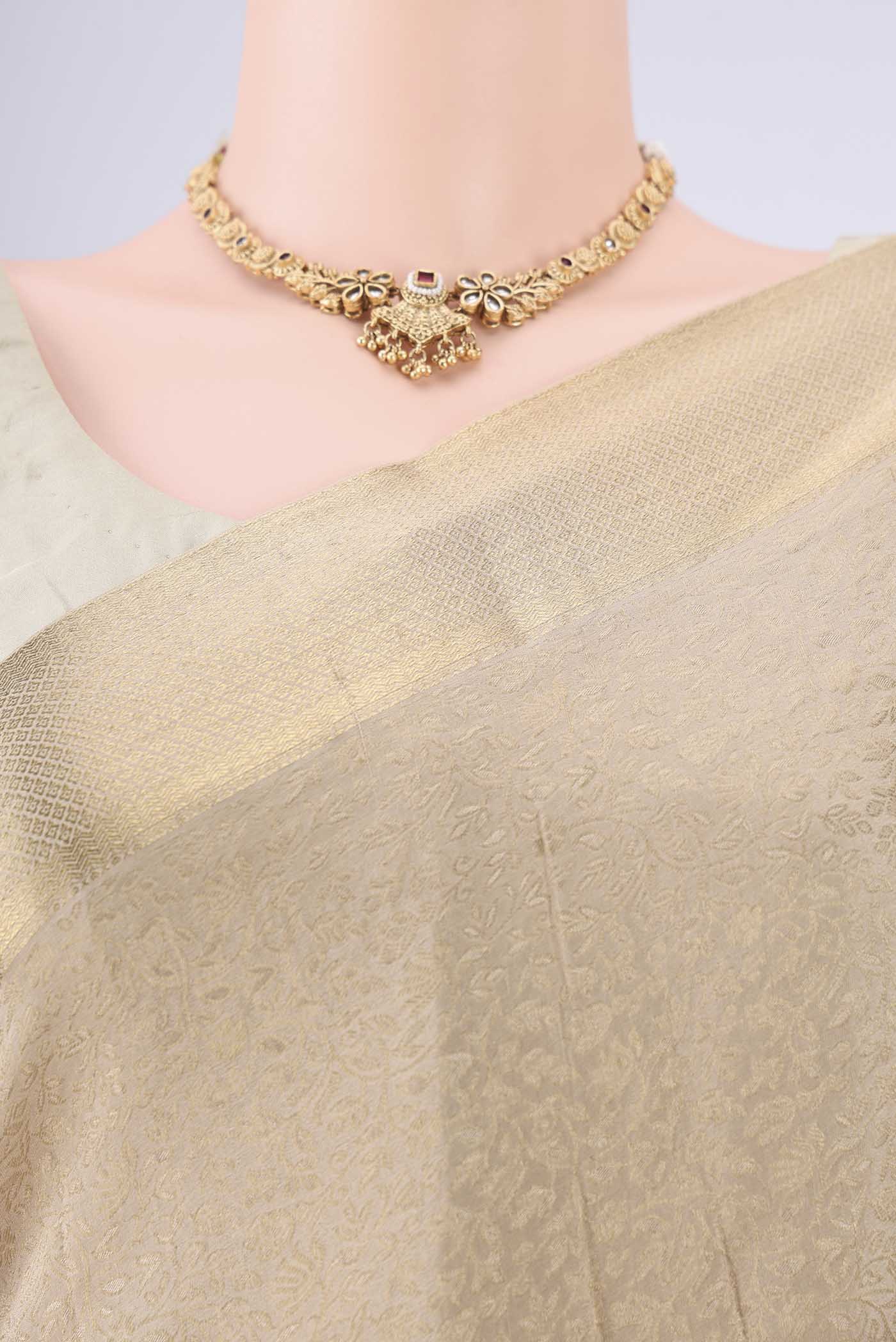 Border image of Beige Mysore Crepe Saree with Zari Brocade on the body and Zari Border. 