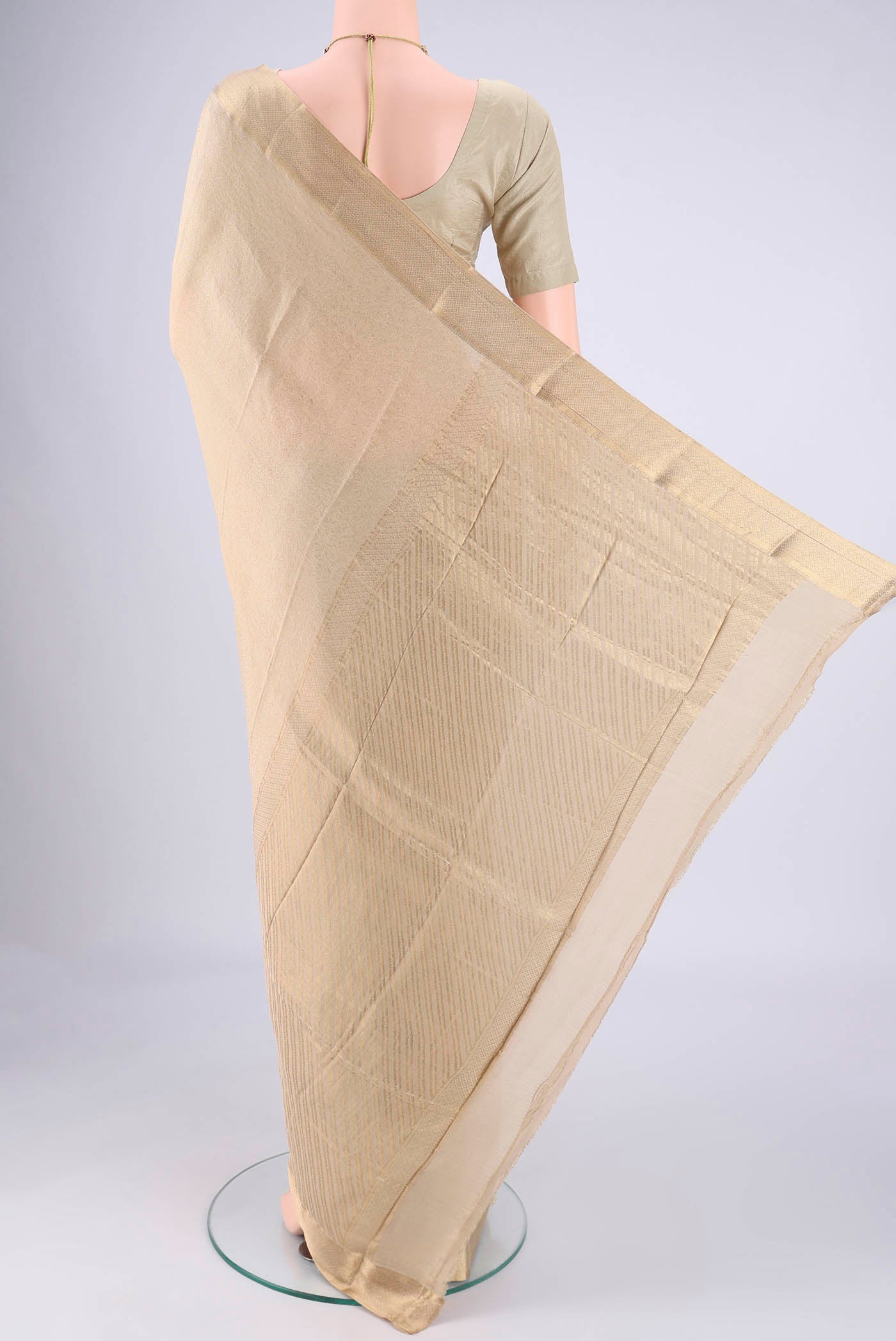 Flat view of Beige Mysore Crepe Saree with Zari Brocade on the body and Zari Border. 