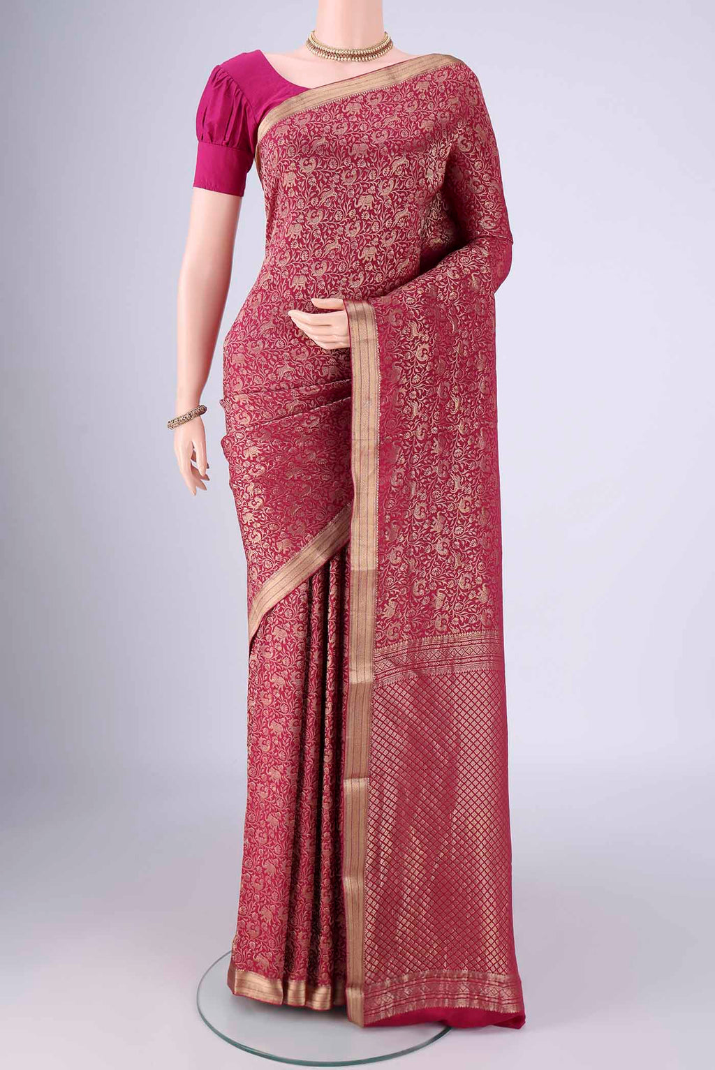 Dark Pink Mysore Crepe Saree with Zari Brocade on the body and Zari Border.  displayed on a mannequin