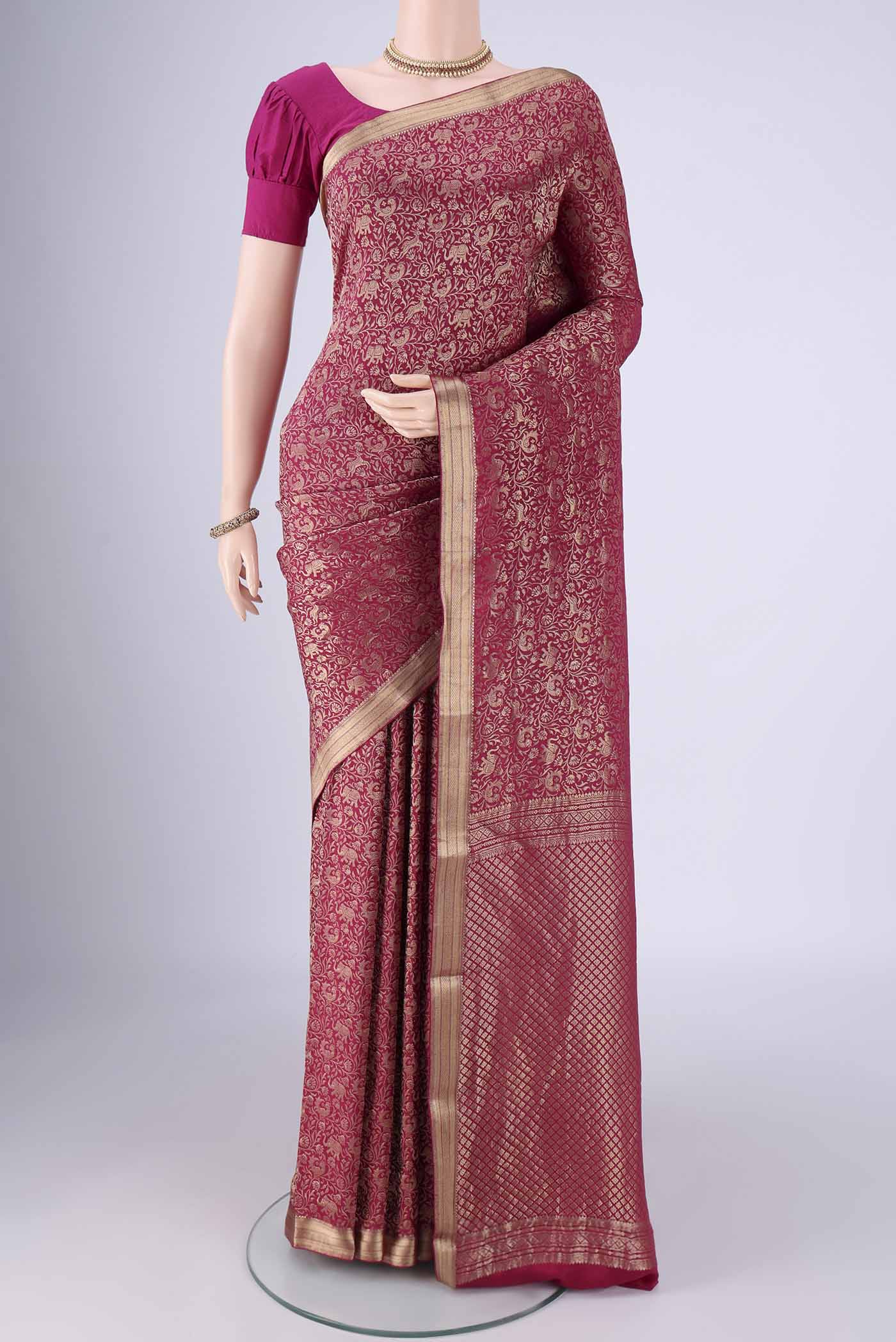 Dark Pink Mysore Crepe Saree with Zari Brocade on the body and Zari Border.  displayed on a mannequin
