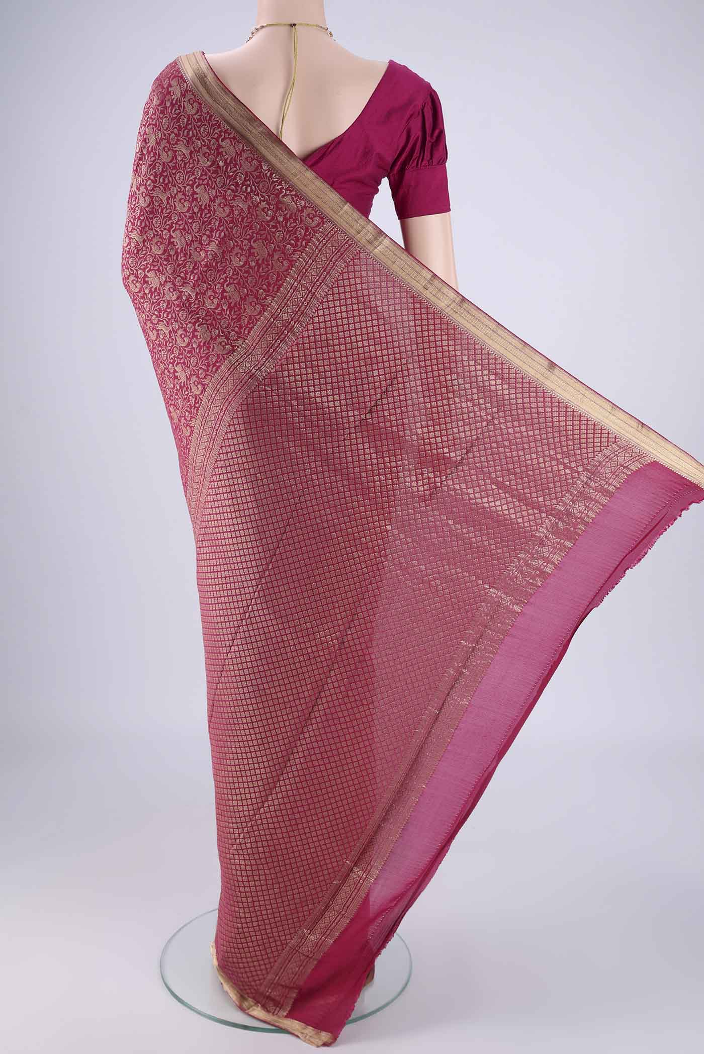 Flat view of Dark Pink Mysore Crepe Saree with Zari Brocade on the body and Zari Border. 