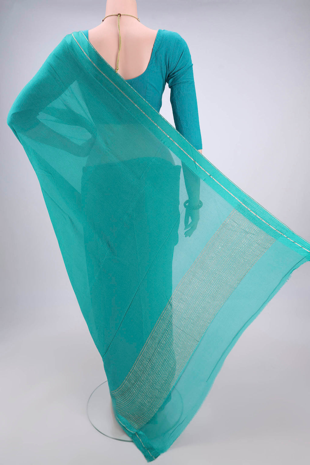 Flat view of Turquoise Mysore Chiffon Saree with Plain Body and Satin Border. 