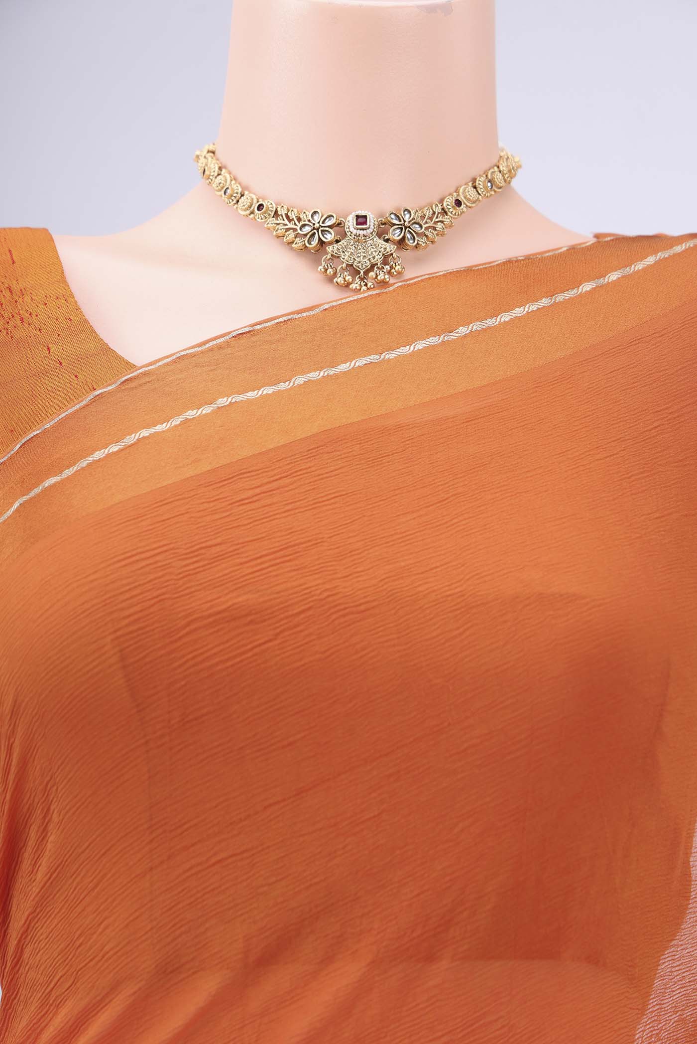 Border image of Rust Mysore Chiffon Saree with Plain Body and Satin Border. 
