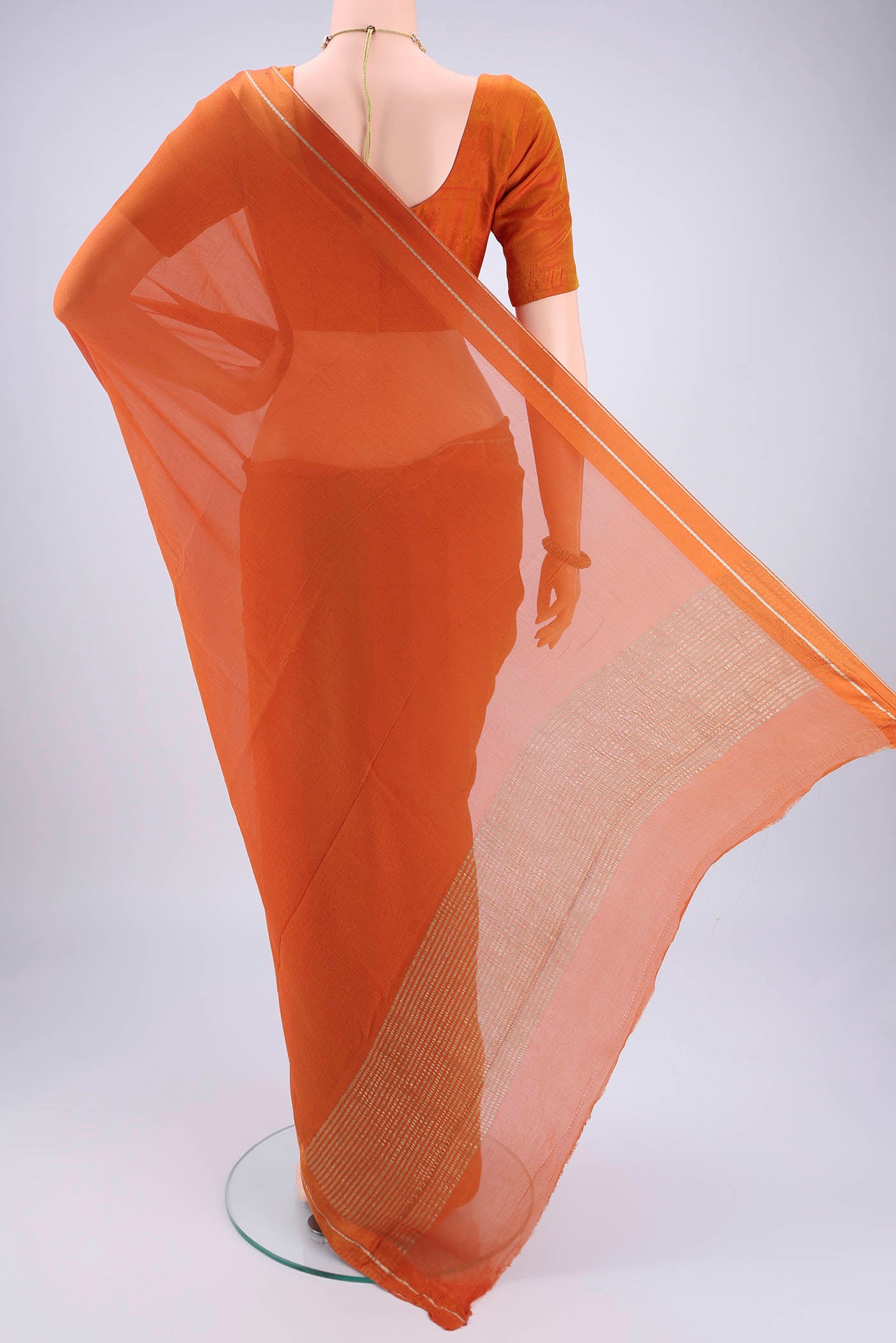 Flat view of Rust Mysore Chiffon Saree with Plain Body and Satin Border. 