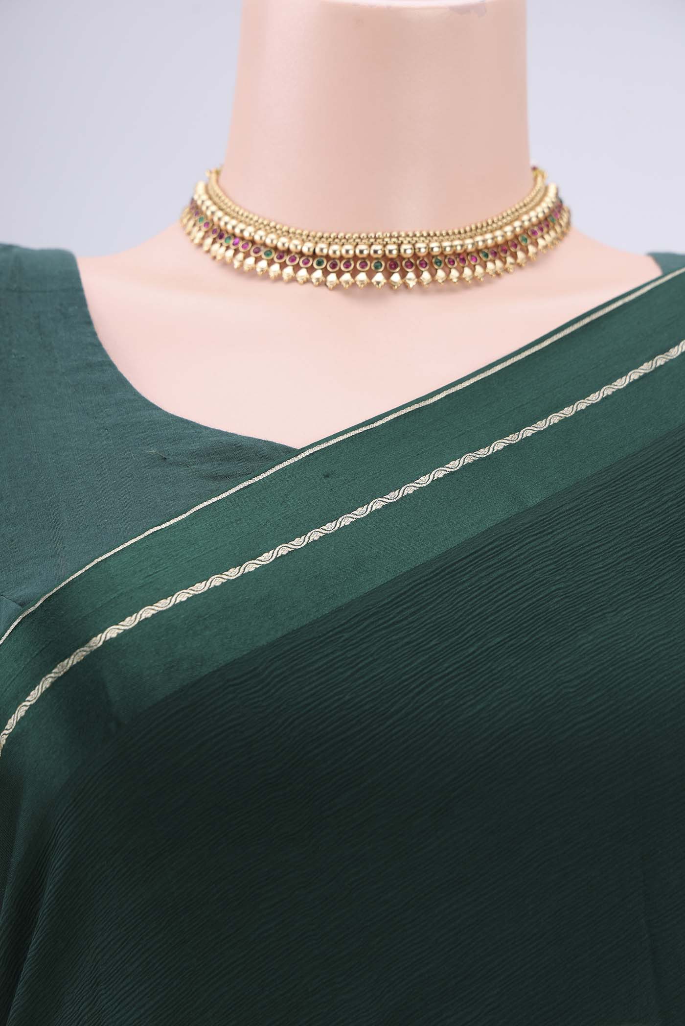 Border image of Bottle Green Mysore Chiffon Saree with Plain Body and Satin Border. 