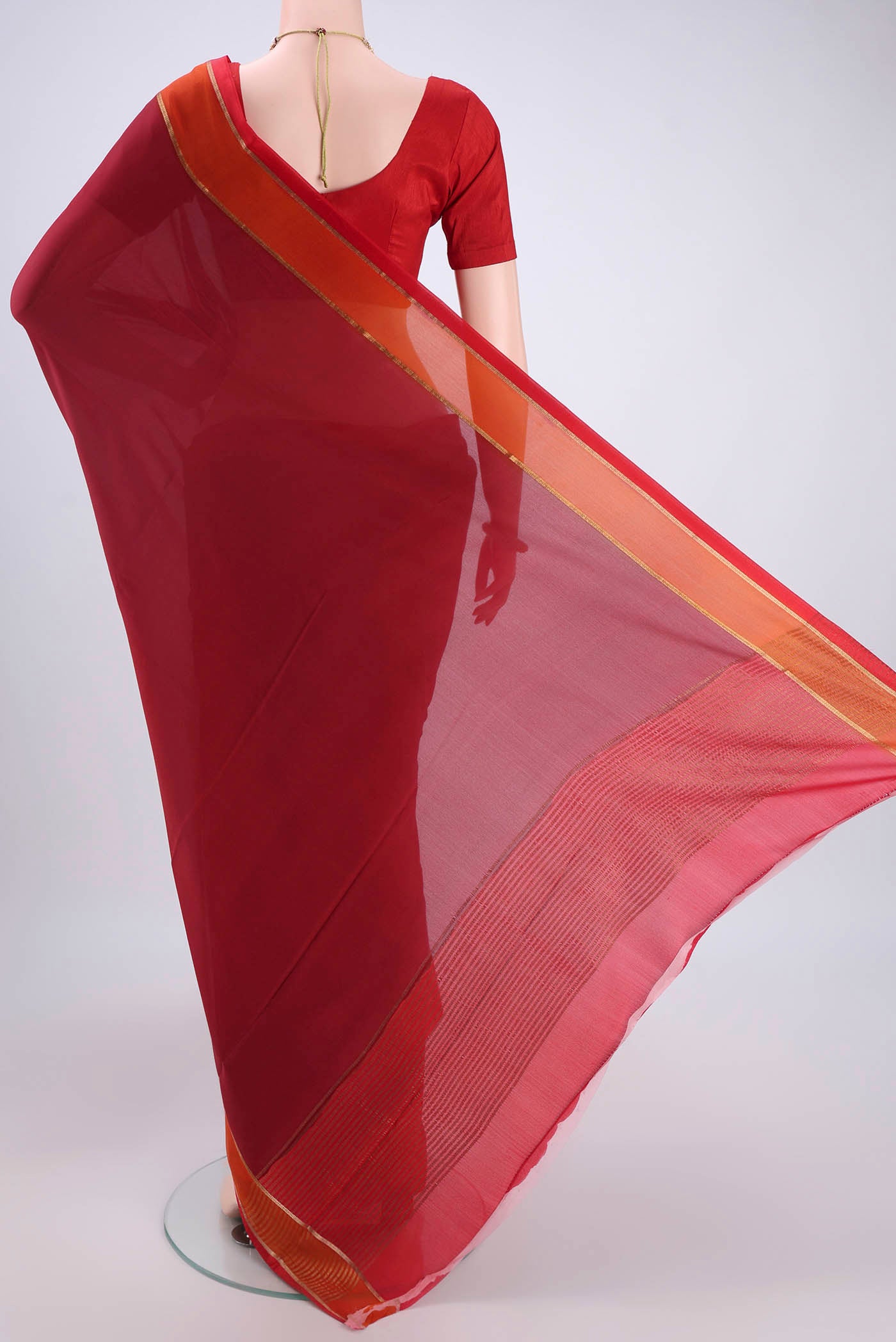 Flat view of Maroon Mysore Crepe Saree with Plain Body and Zari Border. 