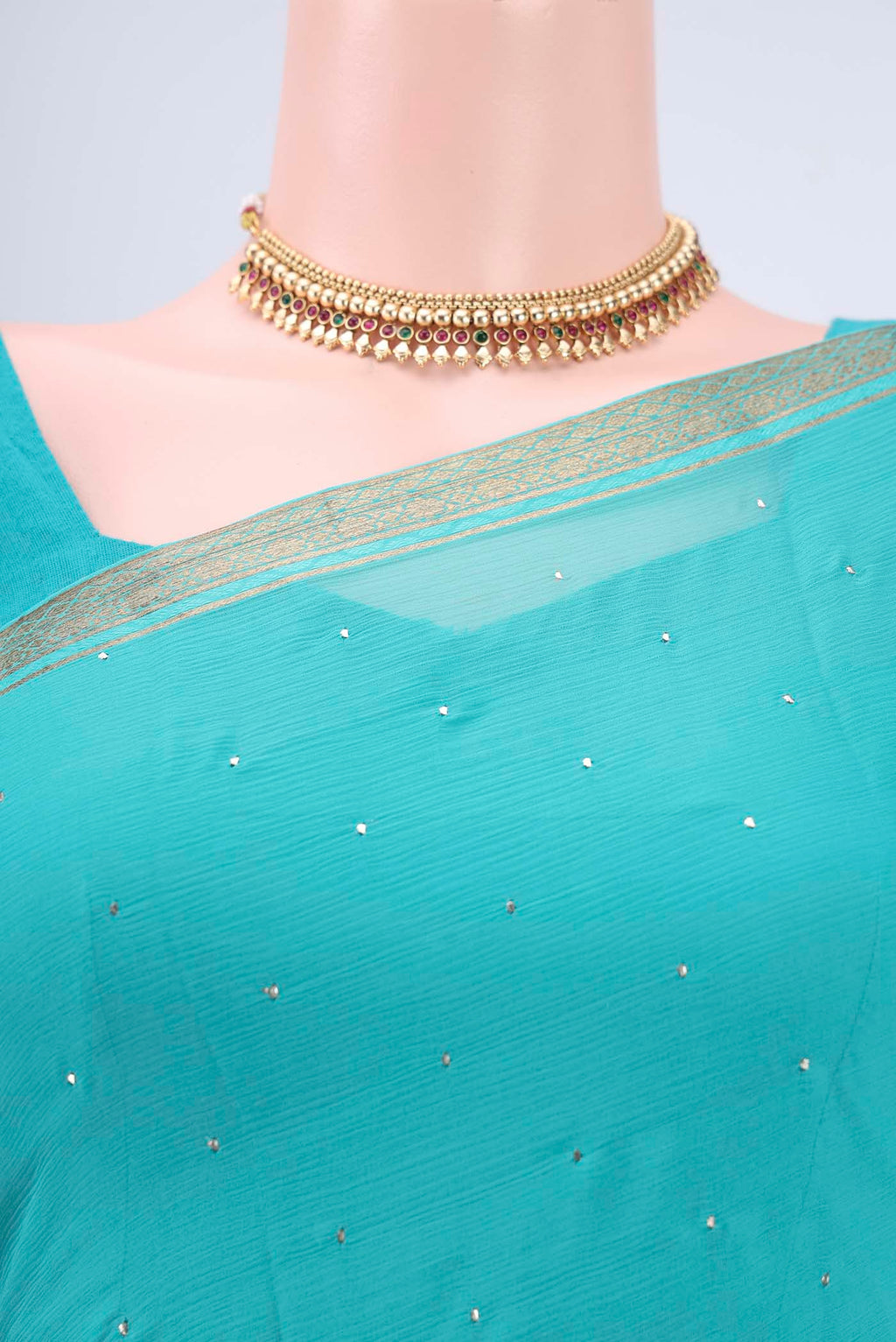 Border image of Turquoise Dual Tone Mysore Chiffon Saree with Embroidery on the body and Zari Border. 