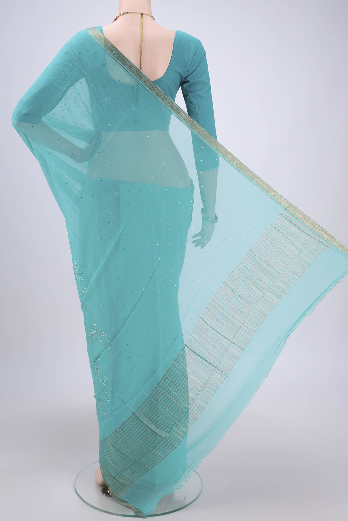 Flat view of Turquoise Dual Tone Mysore Chiffon Saree with Embroidery on the body and Zari Border. 