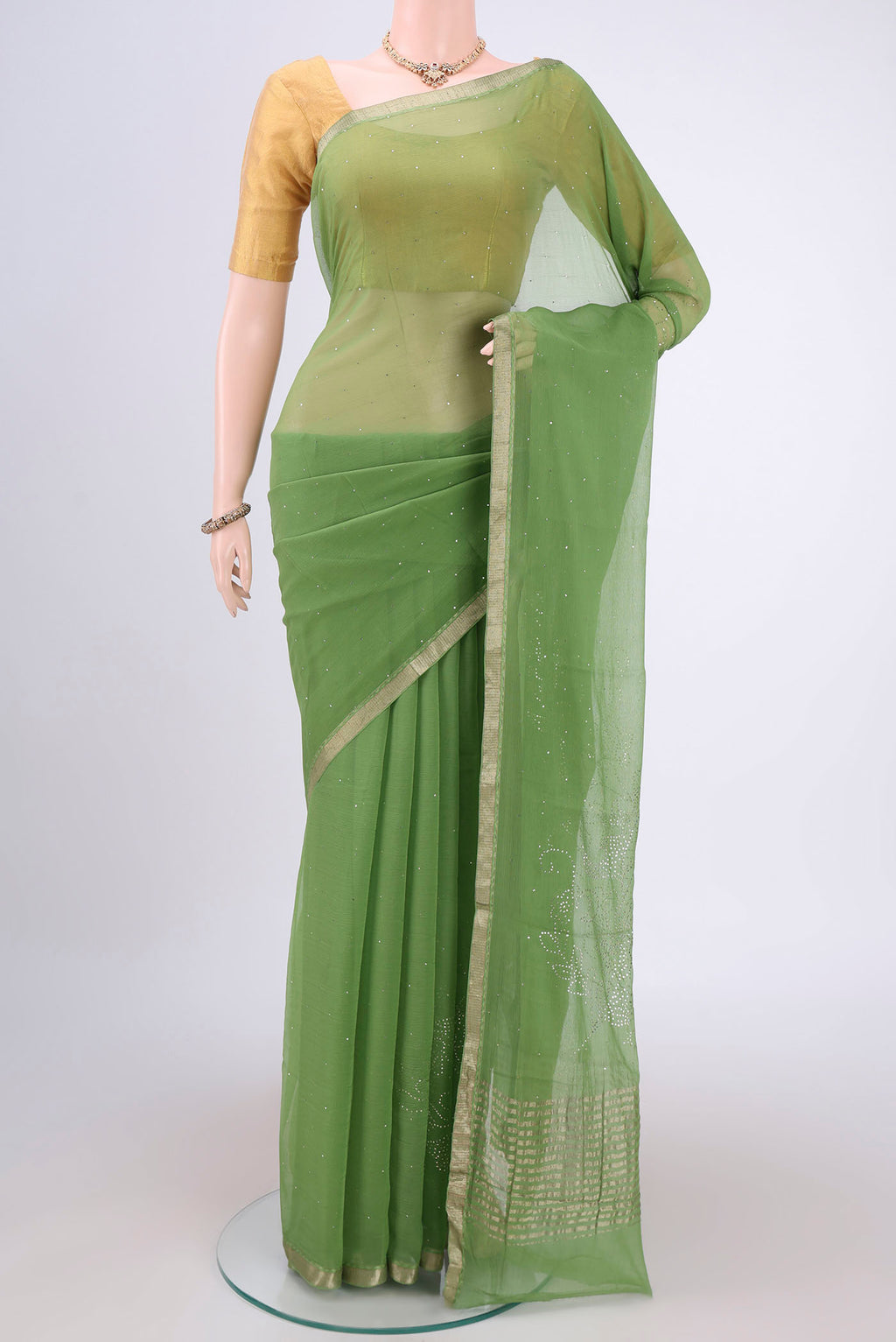 Light Green Mysore Chiffon Saree with Embroidery on the body and Zari Border.  displayed on a mannequin