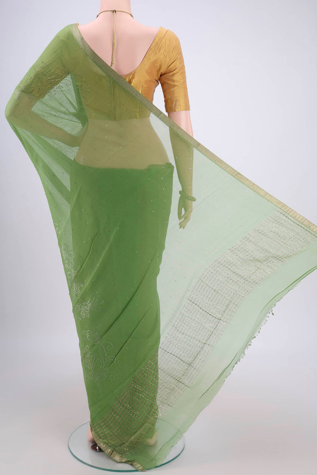Flat view of Light Green Mysore Chiffon Saree with Embroidery on the body and Zari Border. 