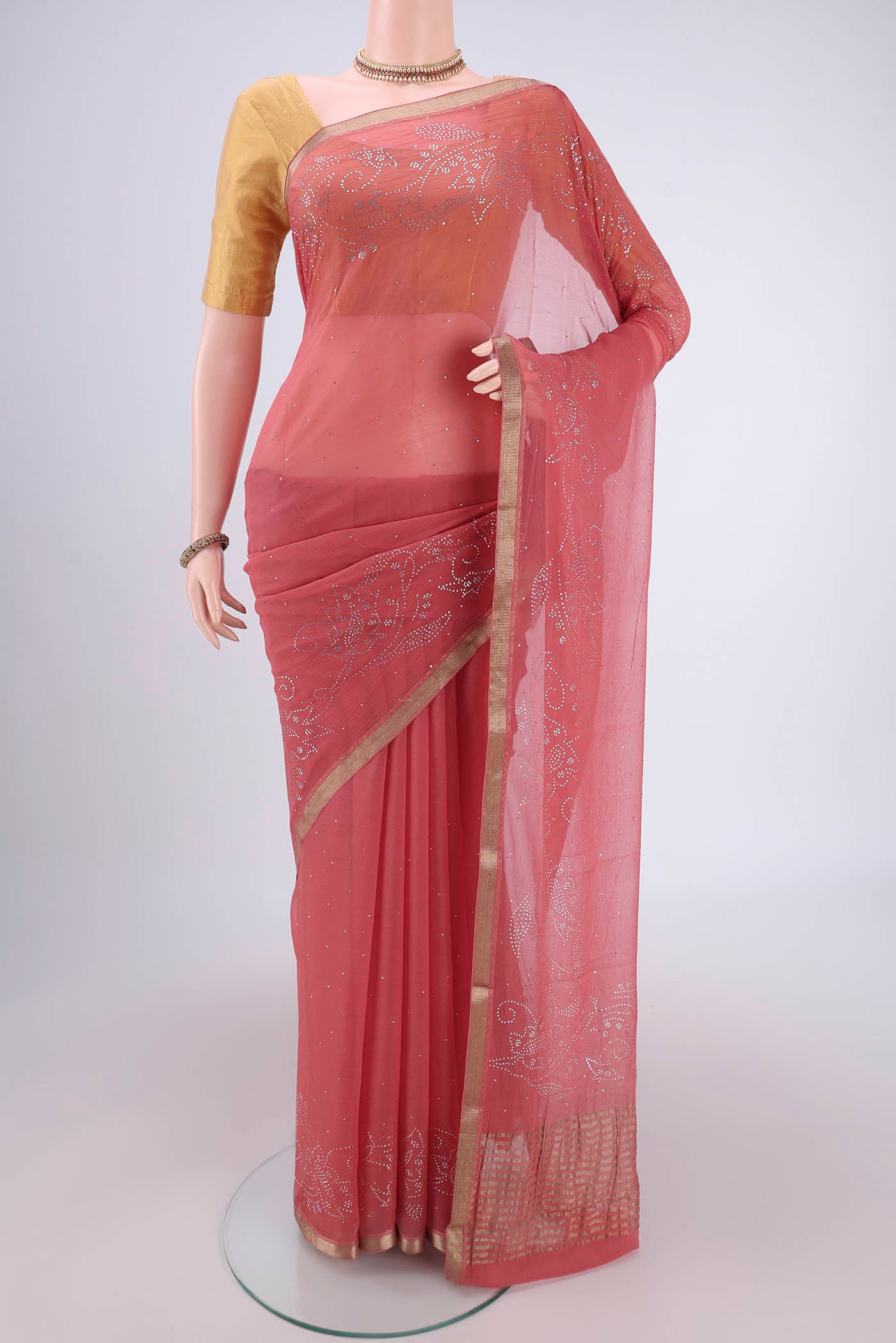 Rose Gold Dual Tone Mysore Chiffon Saree with Embroidery on the body and Zari Border.  displayed on a mannequin