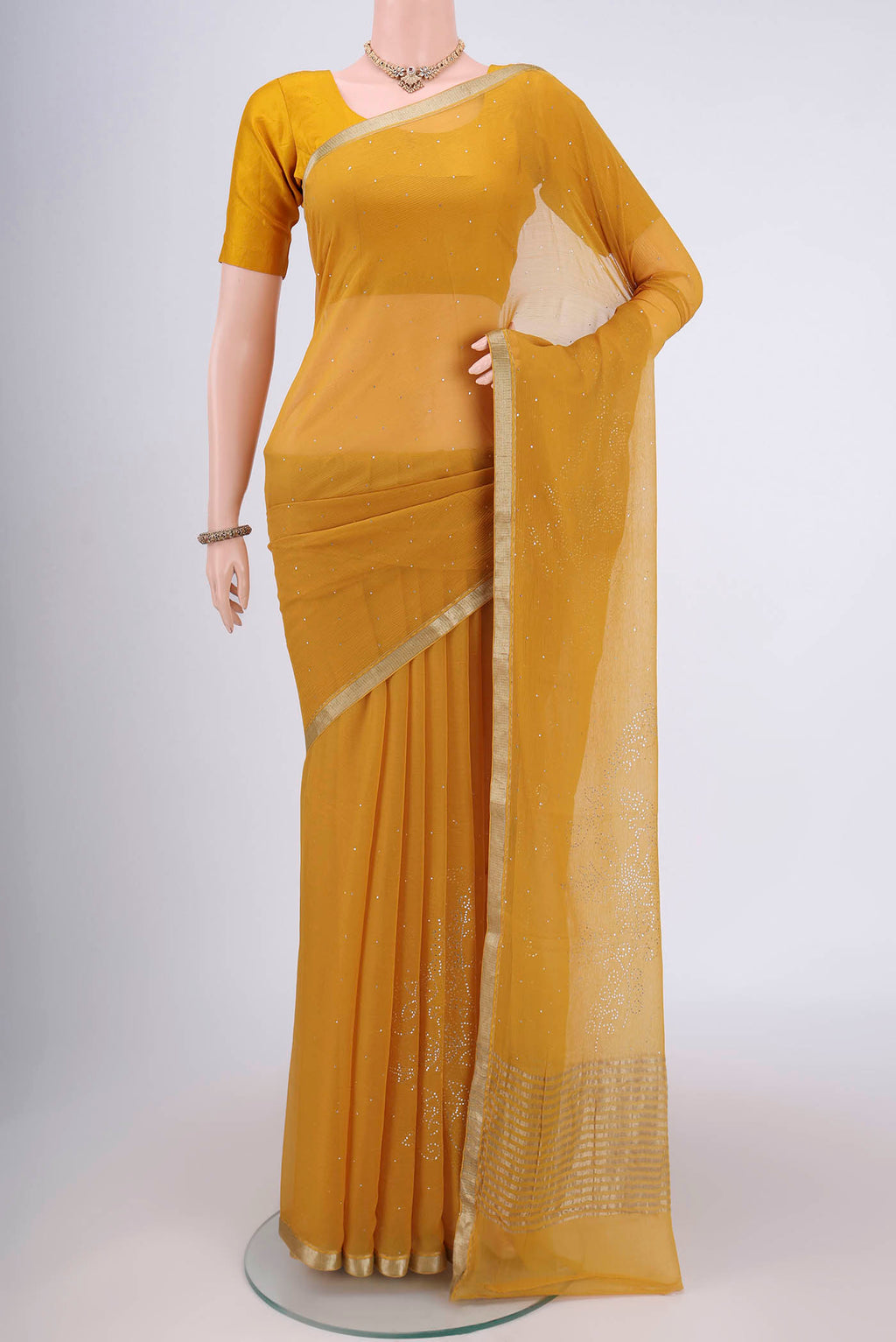 Yellow Dual Tone Mysore Chiffon Saree with Embroidery on the body and Zari Border.  displayed on a mannequin