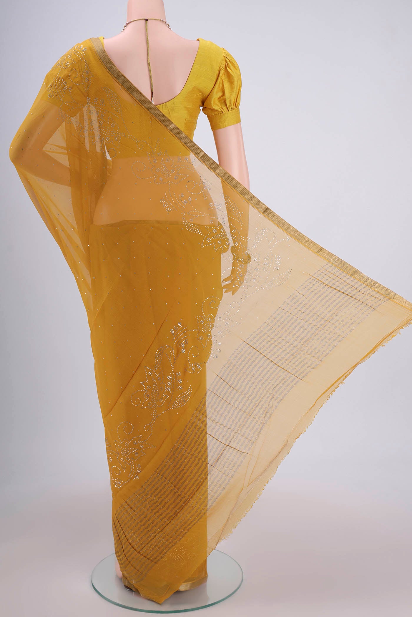 Flat view of Mustard Dual Tone Mysore Chiffon Saree with Embroidery on the body and Zari Border. 