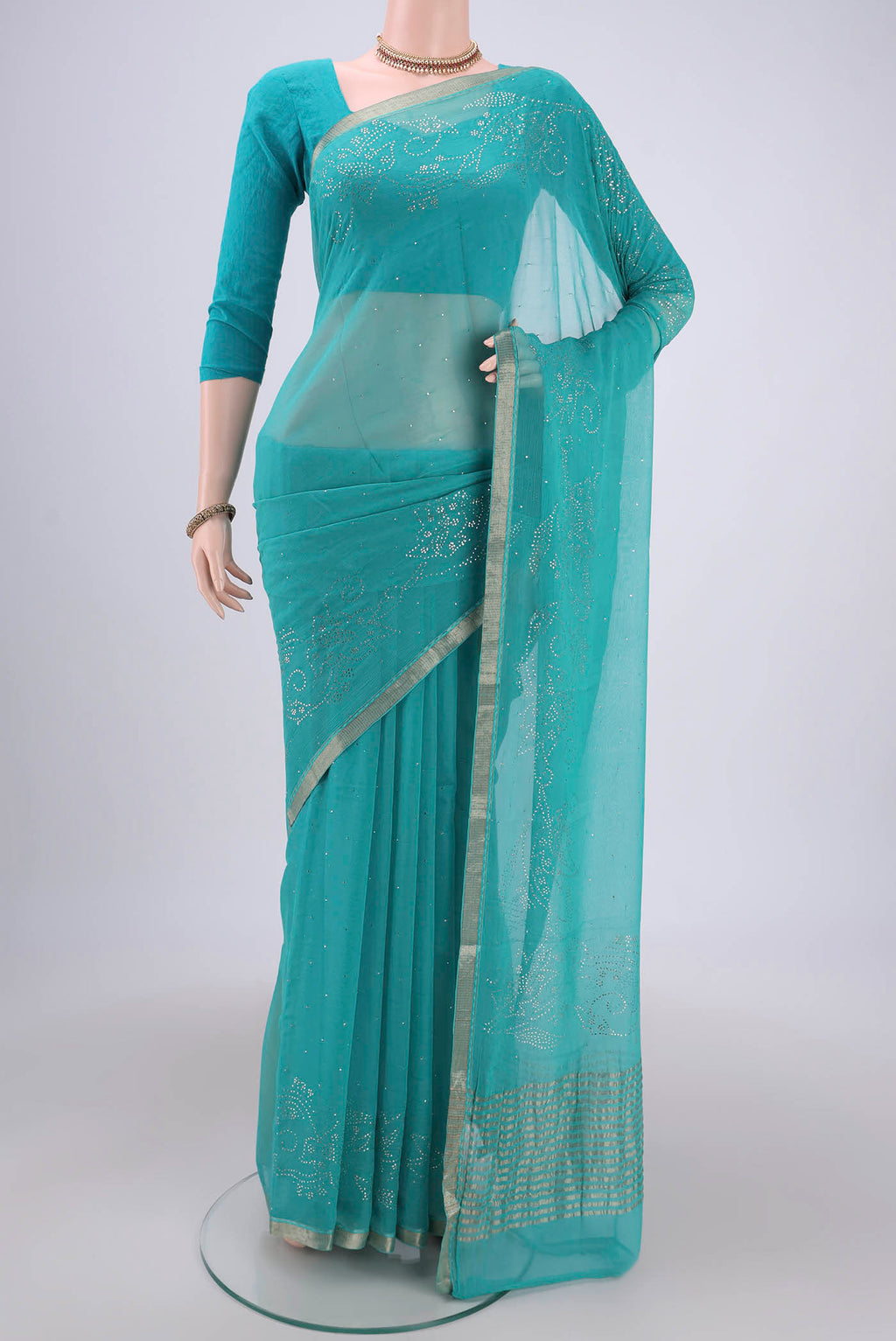 Turquoise Dual Tone Mysore Chiffon Saree with Embroidery on the body and Zari Border.  displayed on a mannequin