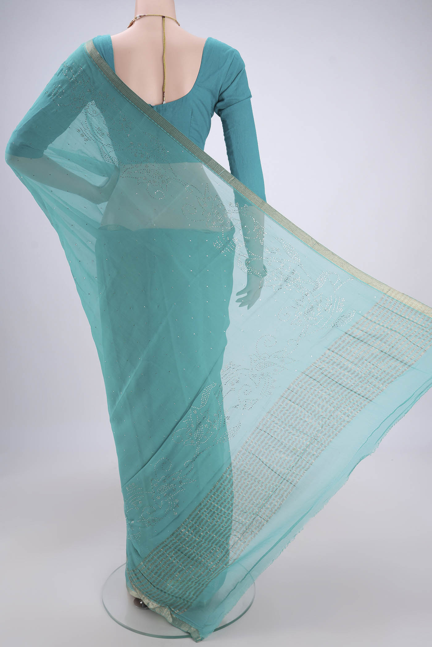 Flat view of Turquoise Dual Tone Mysore Chiffon Saree with Embroidery on the body and Zari Border. 