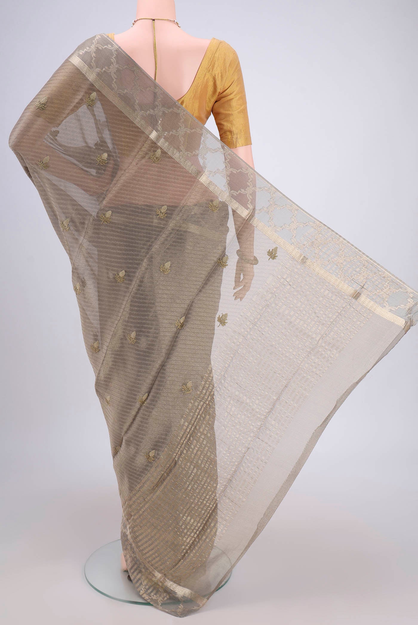 Flat view of Davys Grey Mysore Georgette Saree with Embroidery on the body and Zari Border. 