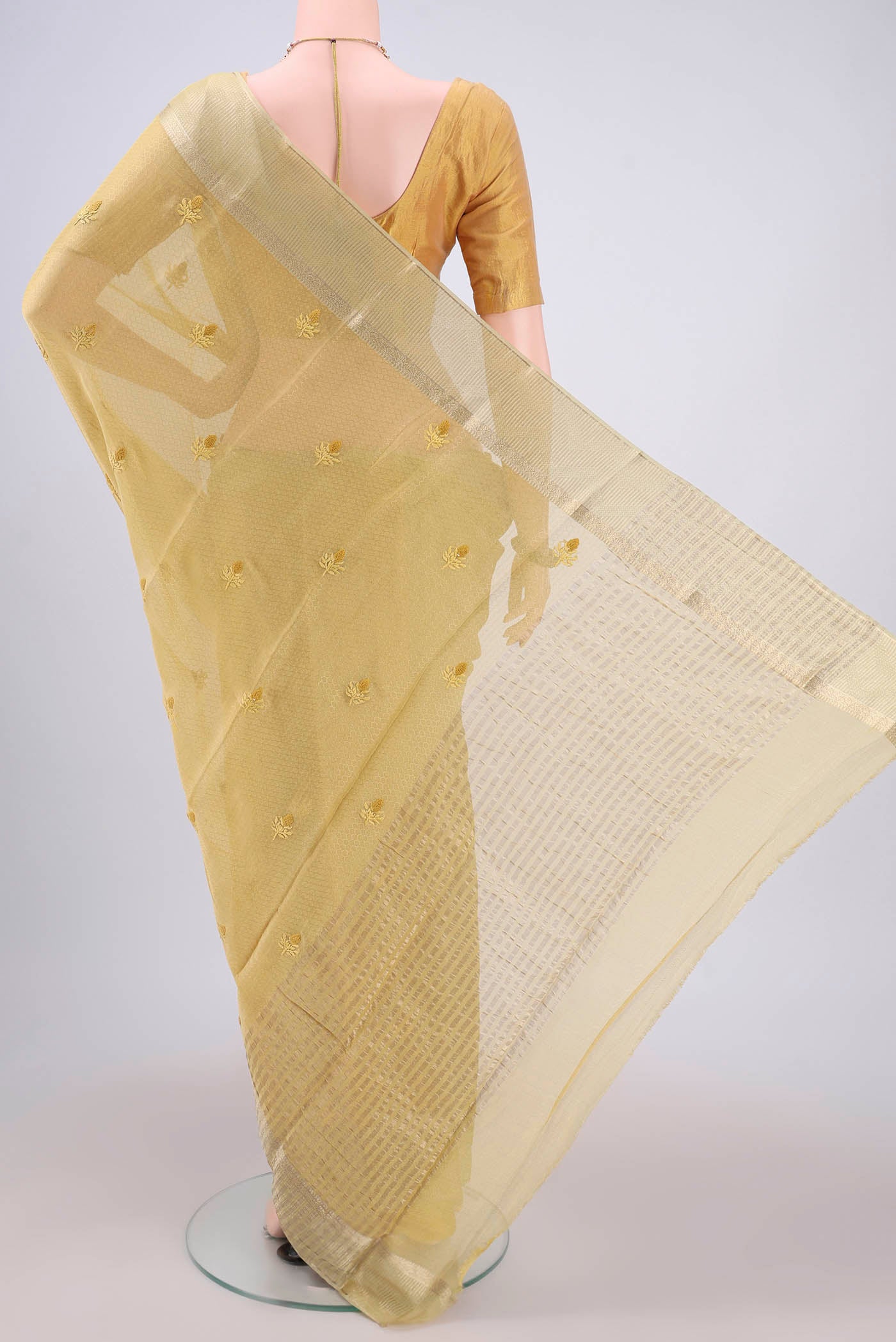 Flat view of Yellow Mysore Georgette Saree with Embroidery on the body and Zari Border. 