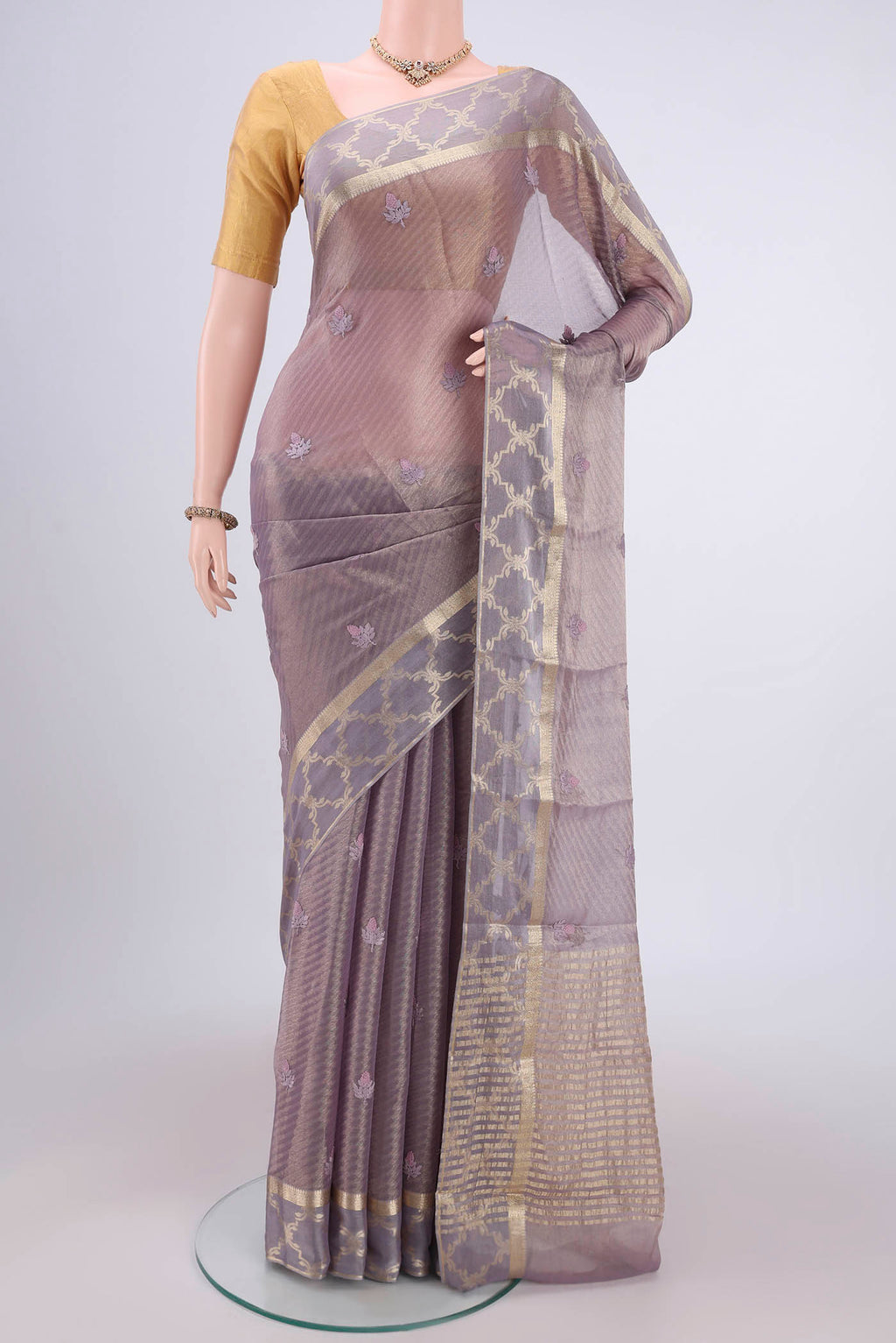 Mauve Mysore Georgette Saree with Embroidery on the body and Zari Border.  displayed on a mannequin