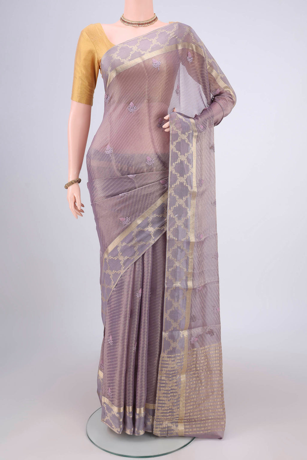 Lavender Mysore Georgette Saree with Embroidery on the body and Zari Border.  displayed on a mannequin