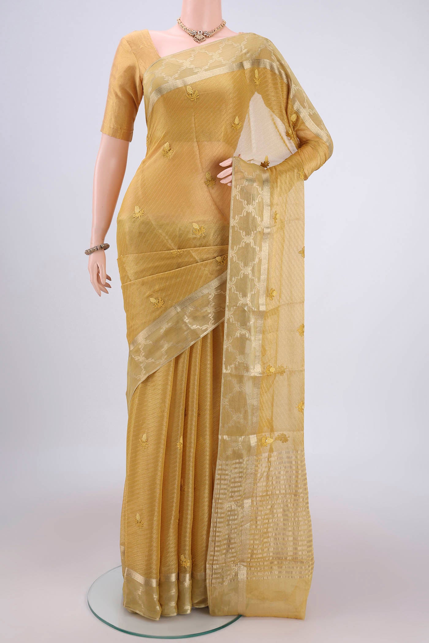 Lemon Yellow Mysore Georgette Saree with Embroidery on the body and Zari Border.  displayed on a mannequin