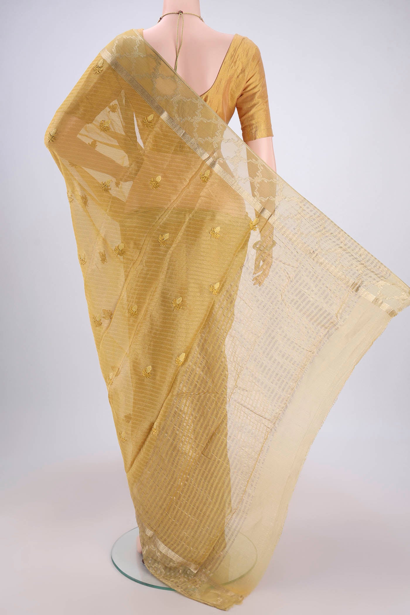 Flat view of Lemon Yellow Mysore Georgette Saree with Embroidery on the body and Zari Border. 