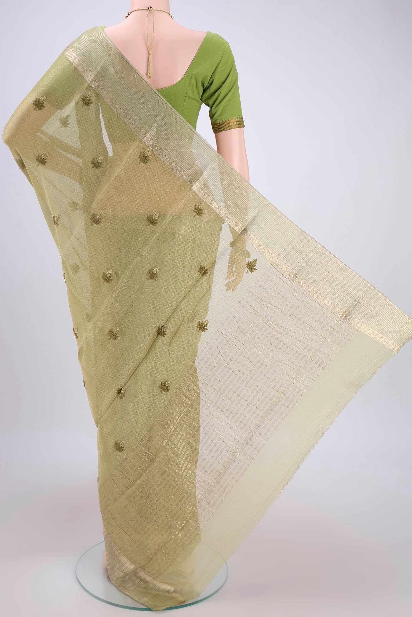 Flat view of Pista Green Mysore Georgette Saree with Embroidery on the body and Zari Border. 