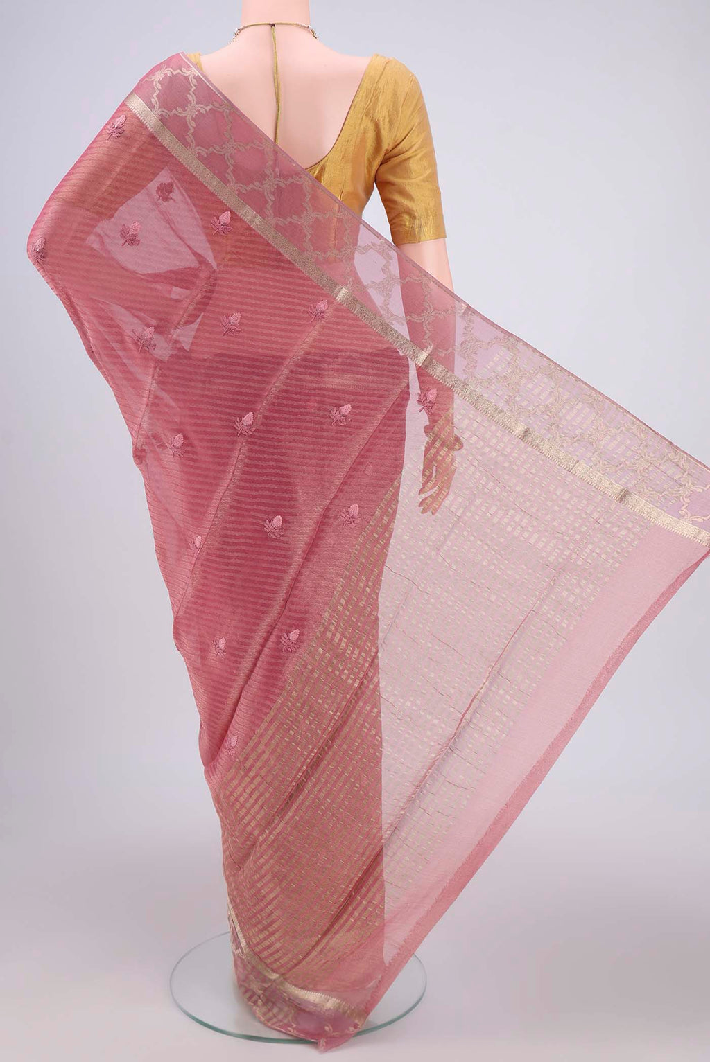 Flat view of Rose Gold Mysore Georgette Saree with Embroidery on the body and Zari Border. 