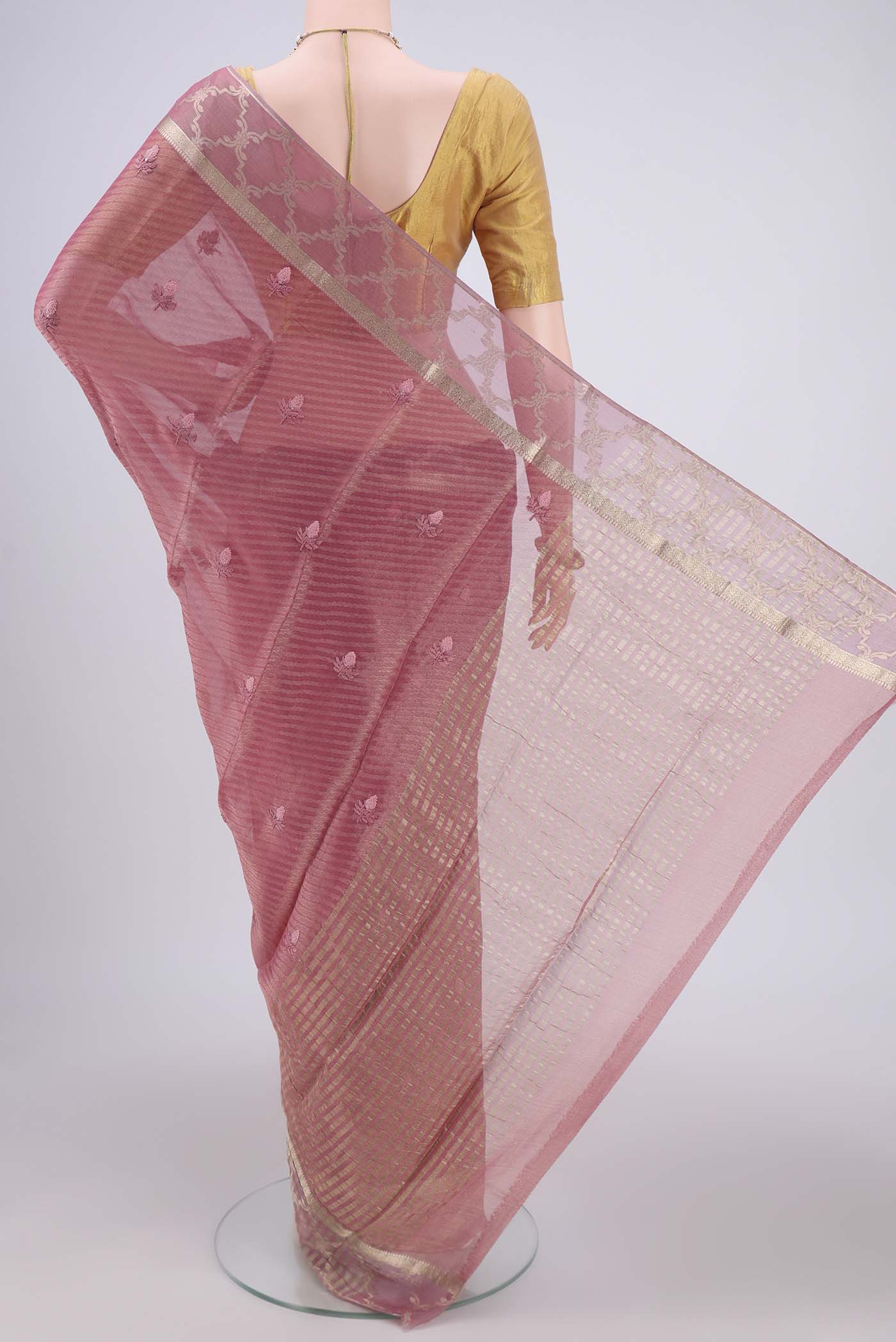 Flat view of Rose Gold Mysore Georgette Saree with Embroidery on the body and Zari Border. 