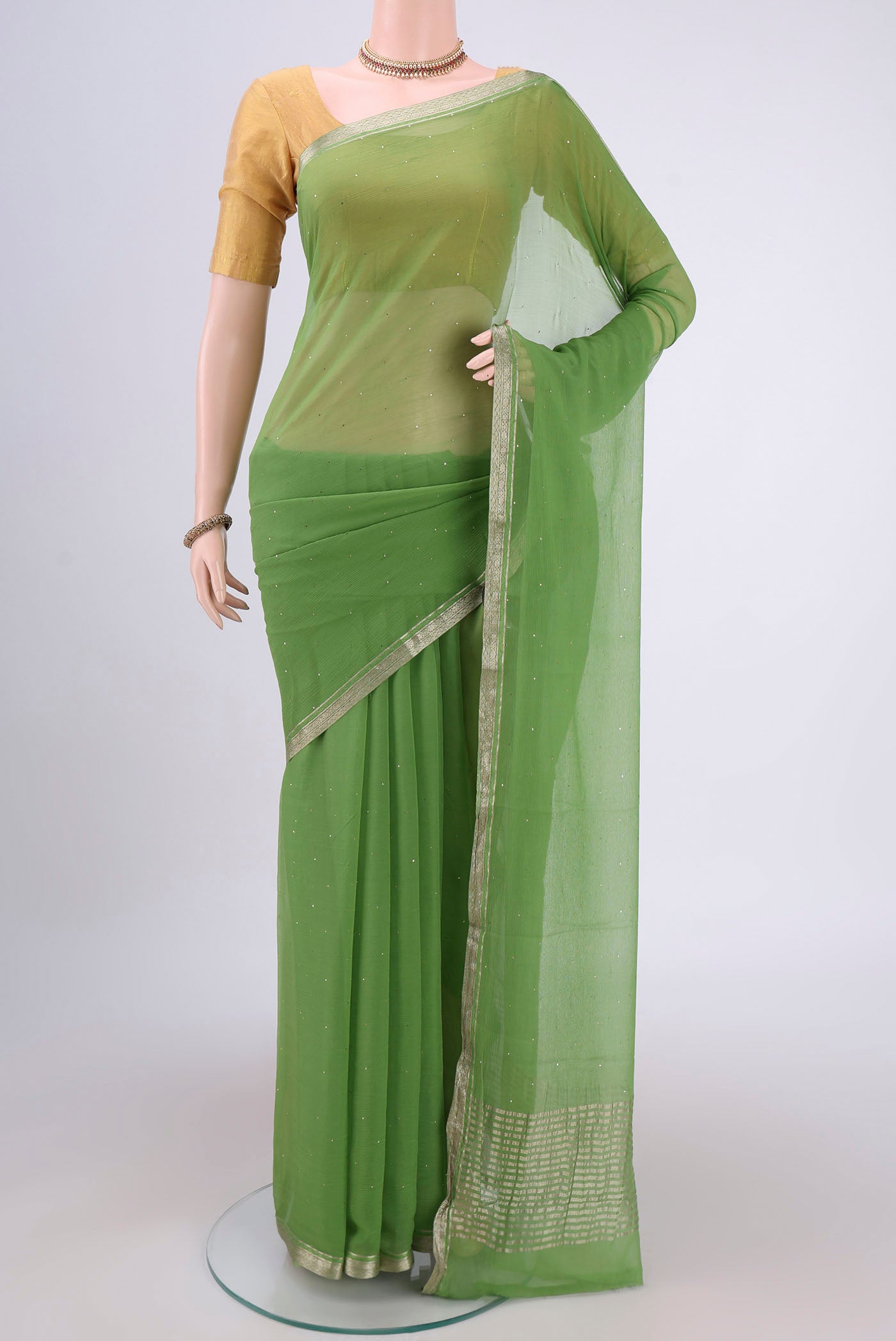 Light Green Dual Tone Mysore Chiffon Saree with Embroidery on the body and Zari Border.  displayed on a mannequin