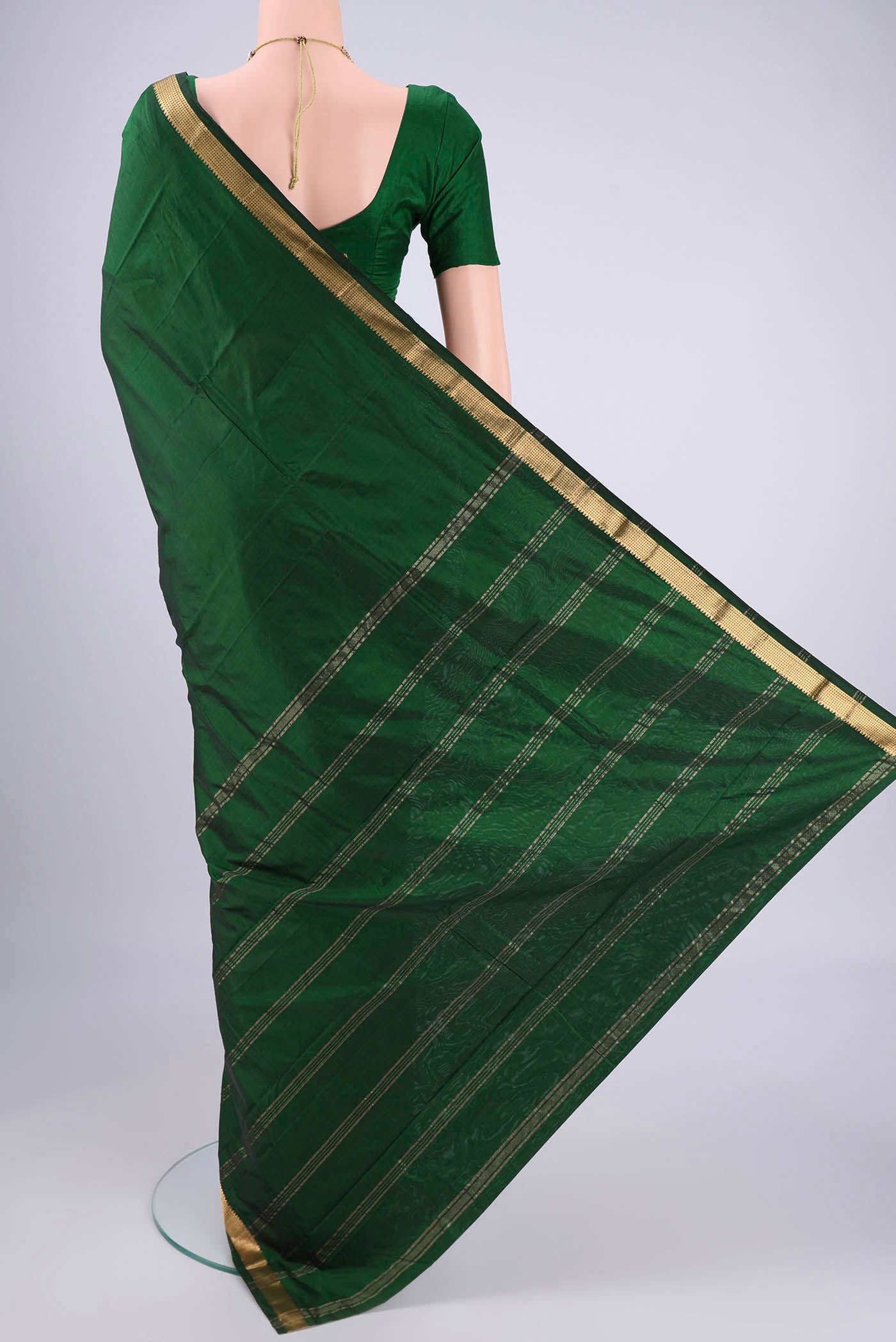 Flat view of Bottle Green Blended Bangalore Silk Saree with Plain Body and Zari Border. 