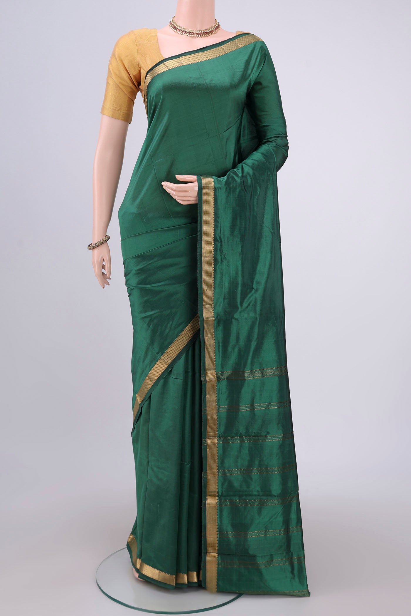 Sea Green Dual Tone Blended Bangalore Silk Saree with Plain Body and Zari Border.  displayed on a mannequin