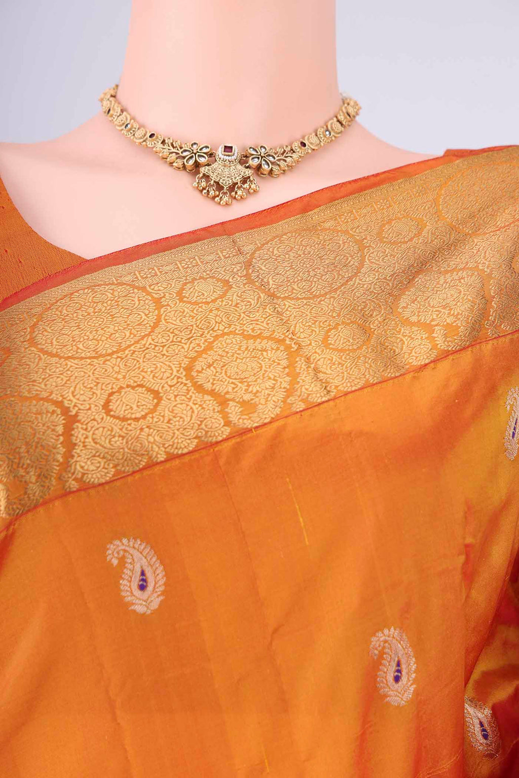 Border image of Orange Dual Tone Blended Bangalore Silk Saree with Zari Butta on the body and Zari Border. 
