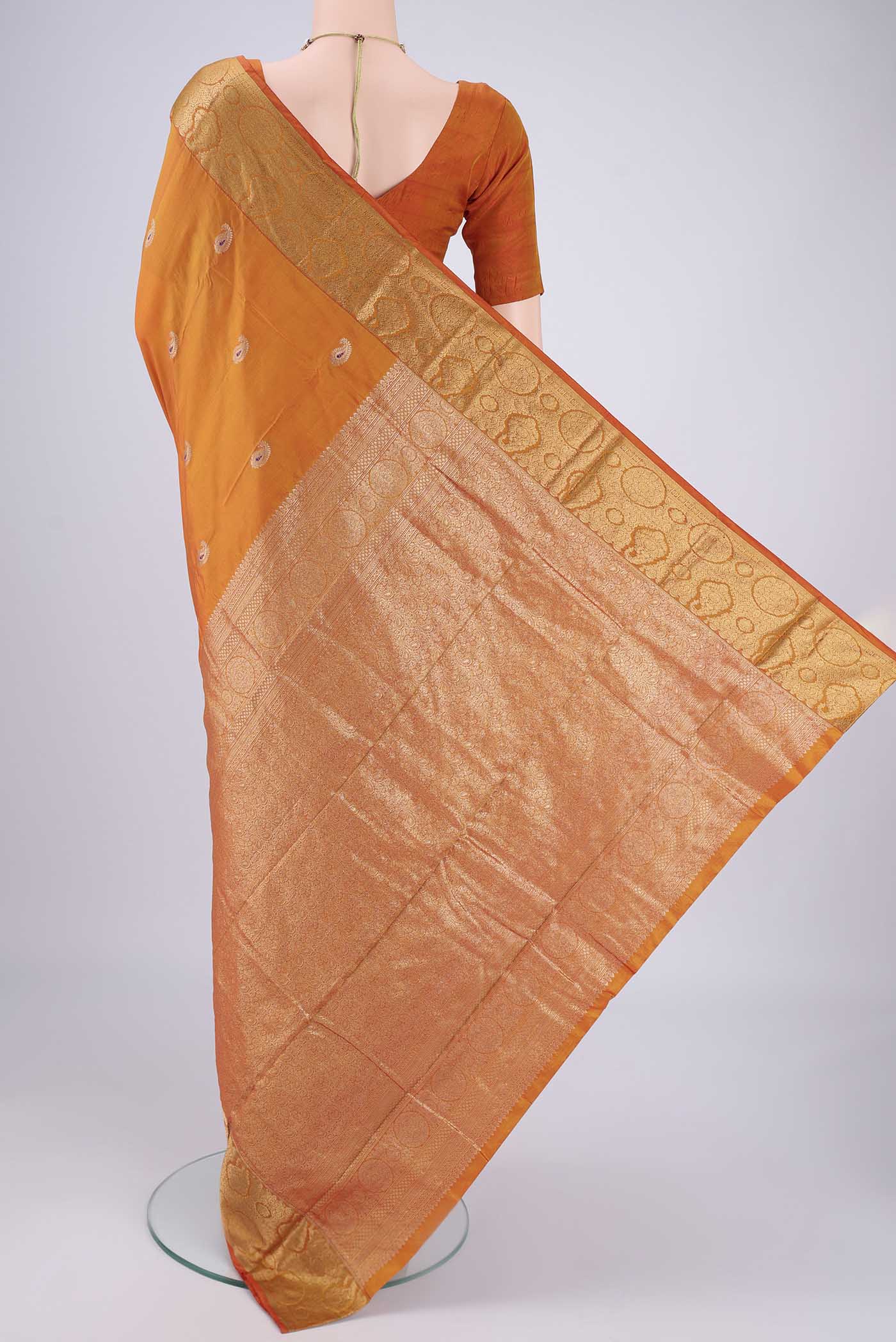 Flat view of Orange Dual Tone Blended Bangalore Silk Saree with Zari Butta on the body and Zari Border. 