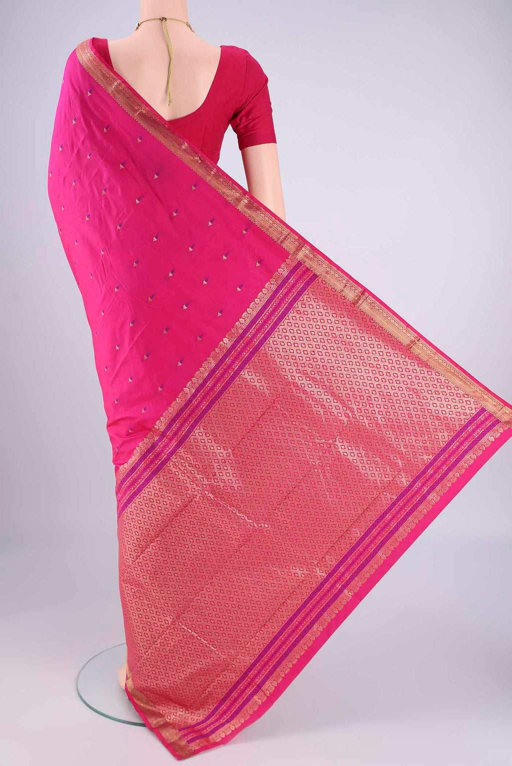 Flat view of Rani Pink Blended Bangalore Silk Saree with Zari And Thread Butta on the body and Zari Border. 
