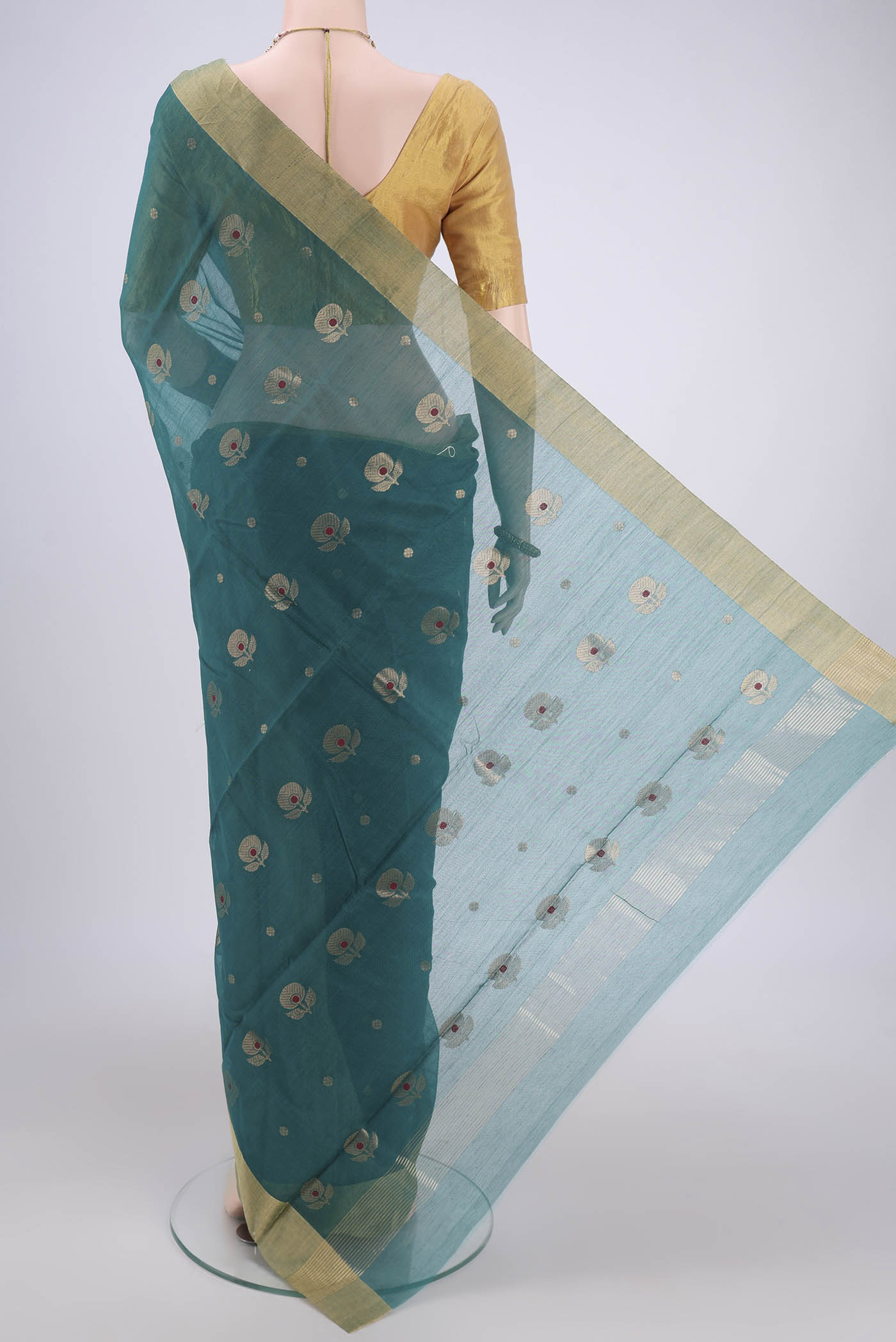 Flat view of Green Chanderi Silk Cotton Saree with Zari And Thread Butta on the body and Zari Border. 