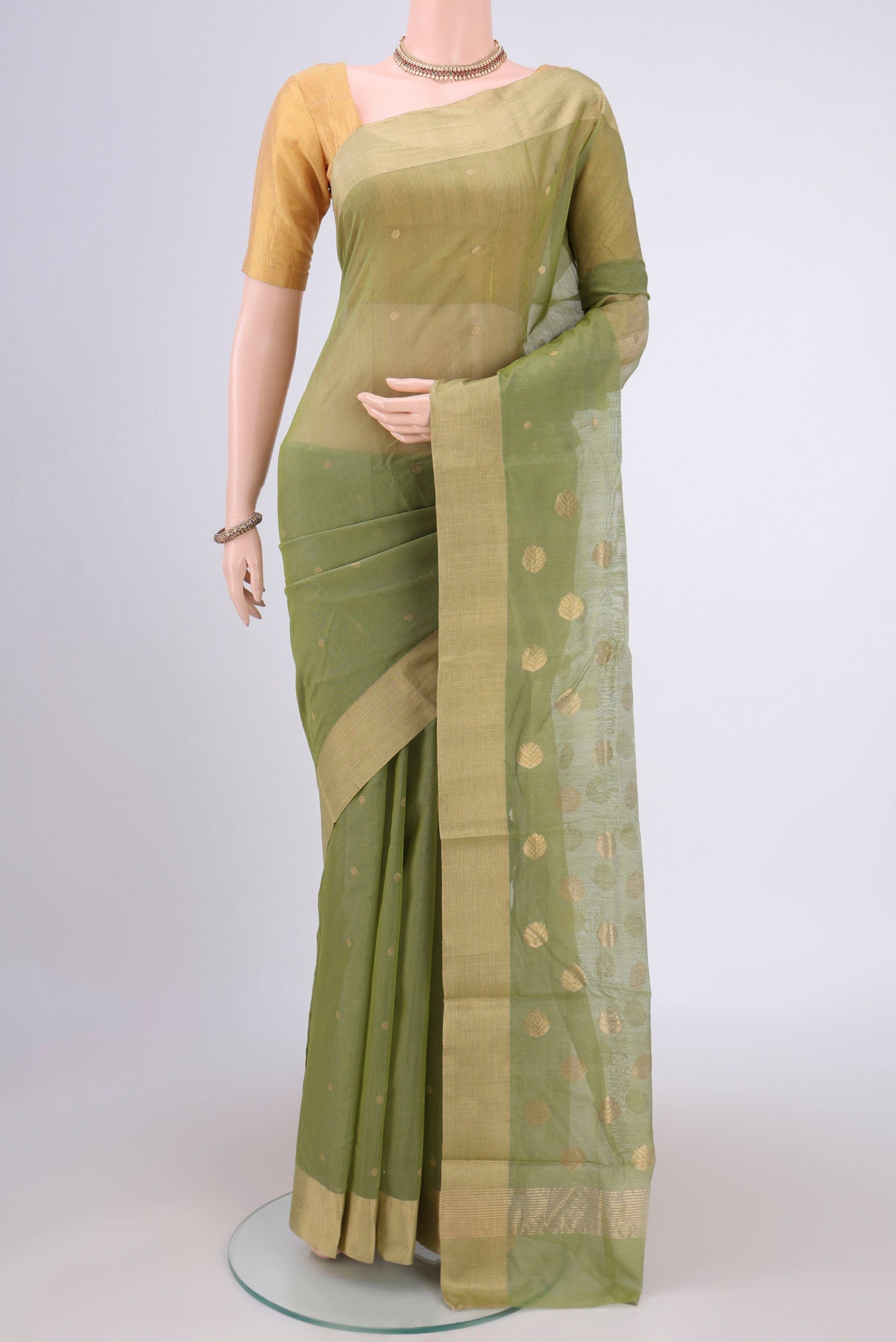 Light Green Chanderi Silk Cotton Saree with Zari Butta on the body and Zari Border.  displayed on a mannequin