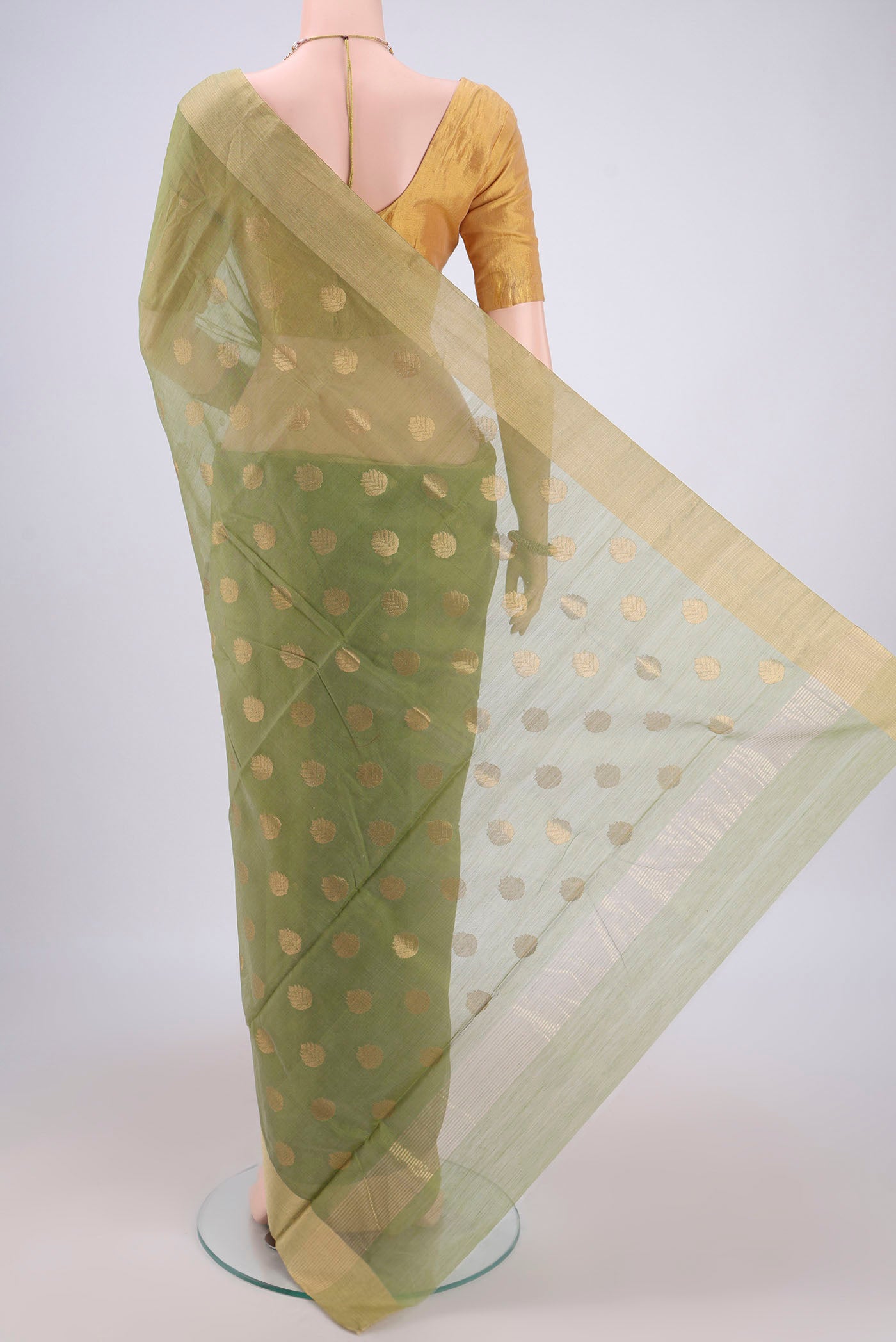 Flat view of Light Green Chanderi Silk Cotton Saree with Zari Butta on the body and Zari Border. 
