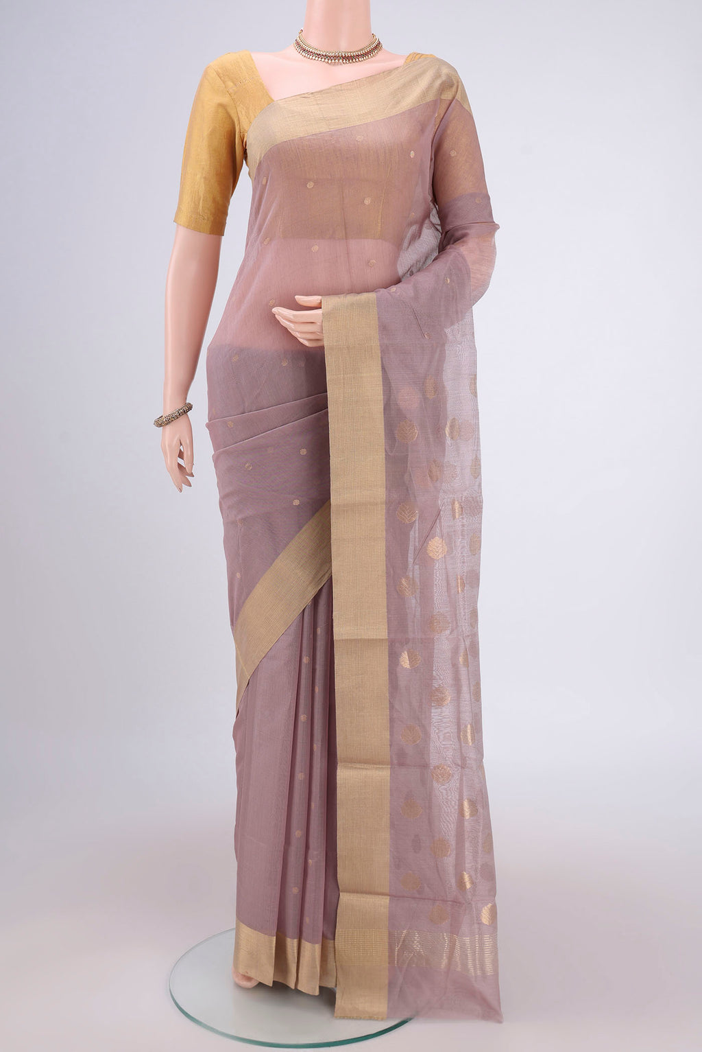 Mauve Chanderi Silk Cotton Saree with Zari Butta on the body and Zari Border.  displayed on a mannequin