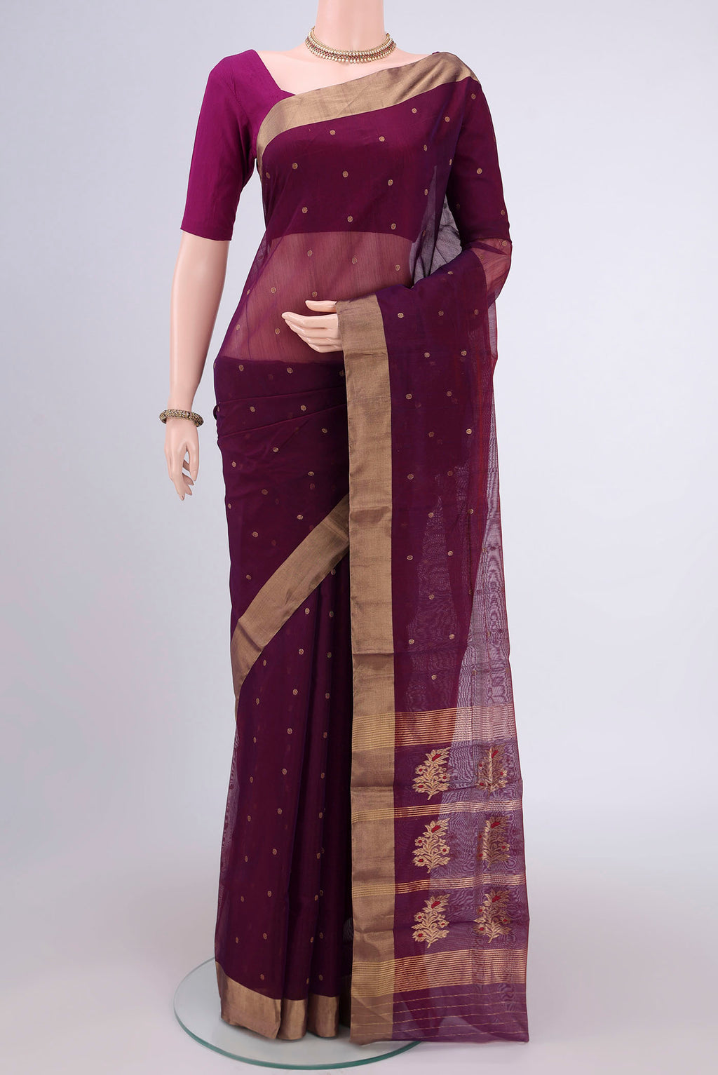 Magenta Chanderi Silk Cotton Saree with Zari Butta on the body and Zari Border.  displayed on a mannequin