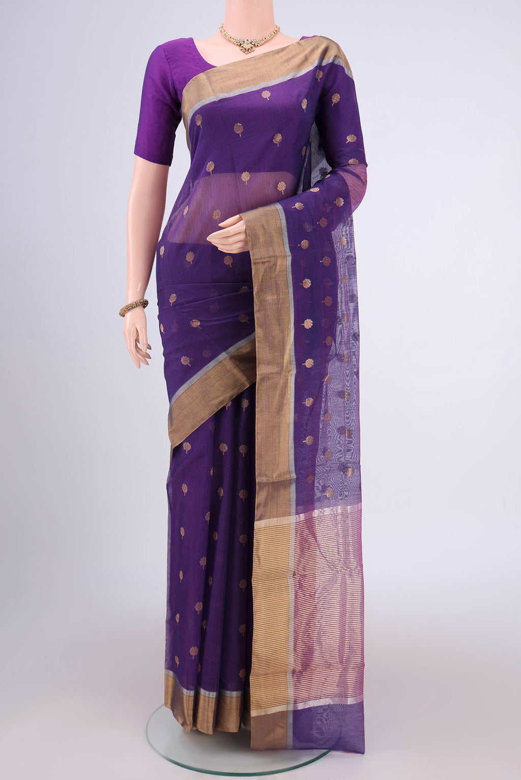 Purple Chanderi Silk Cotton Saree with Zari Butta on the body and Zari Border.  displayed on a mannequin