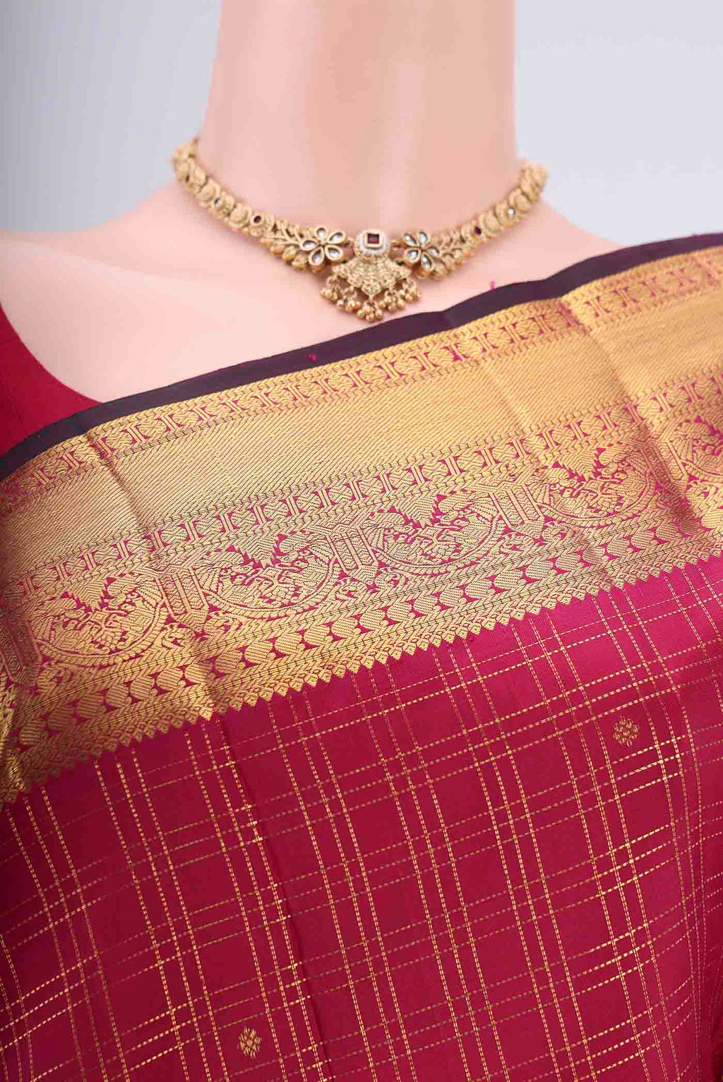 Border image of Maroon Dual Tone Kanjivaram Silk Saree with Checked design on the body and Zari Border. 